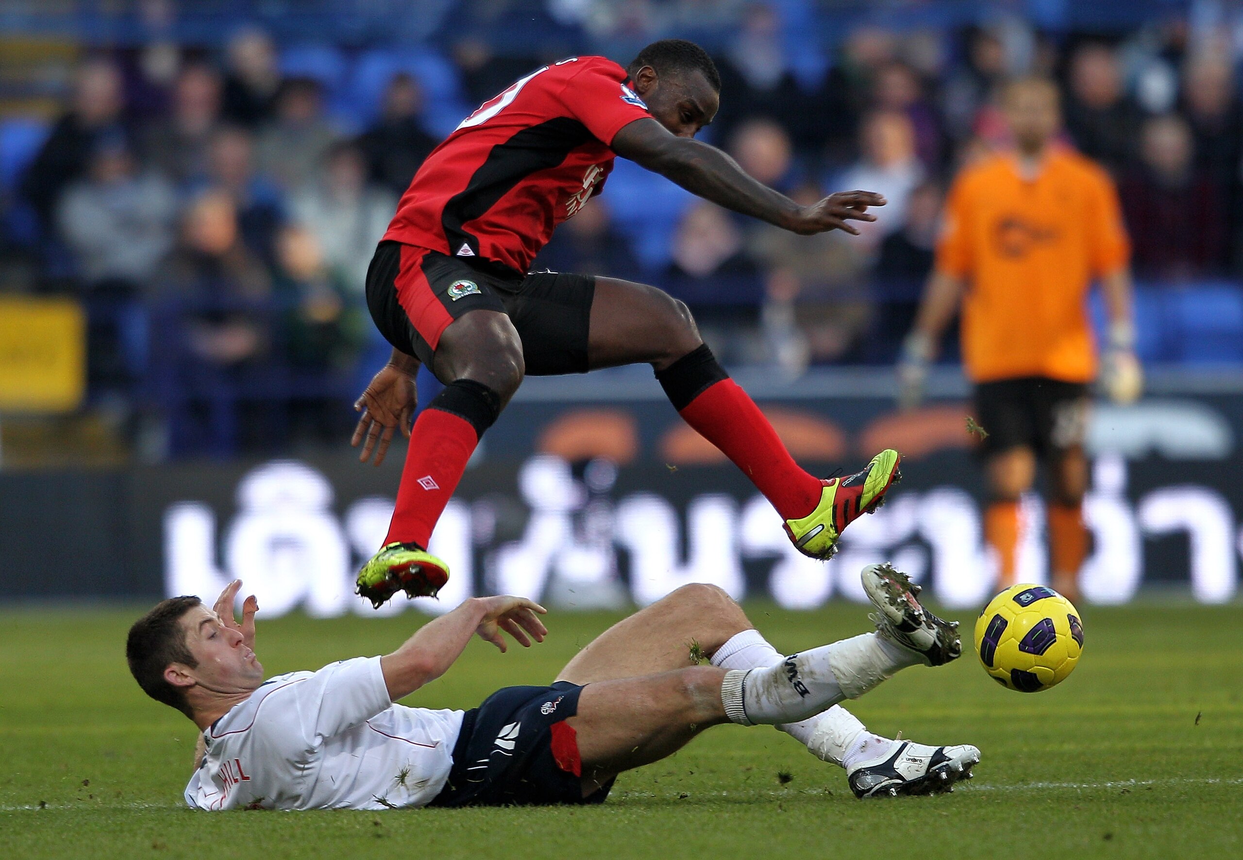 BOLTON, ENGLAND - DECEMBER 12:  Gary Cahill of Bolton Wanderers tackles Jason Roberts of Blackburn Rovers during the Barclays Premier League match between Bolton Wanderers and Blackburn Rovers at the Reebok Stadium on December 12, 2010 in Bolton, England.
