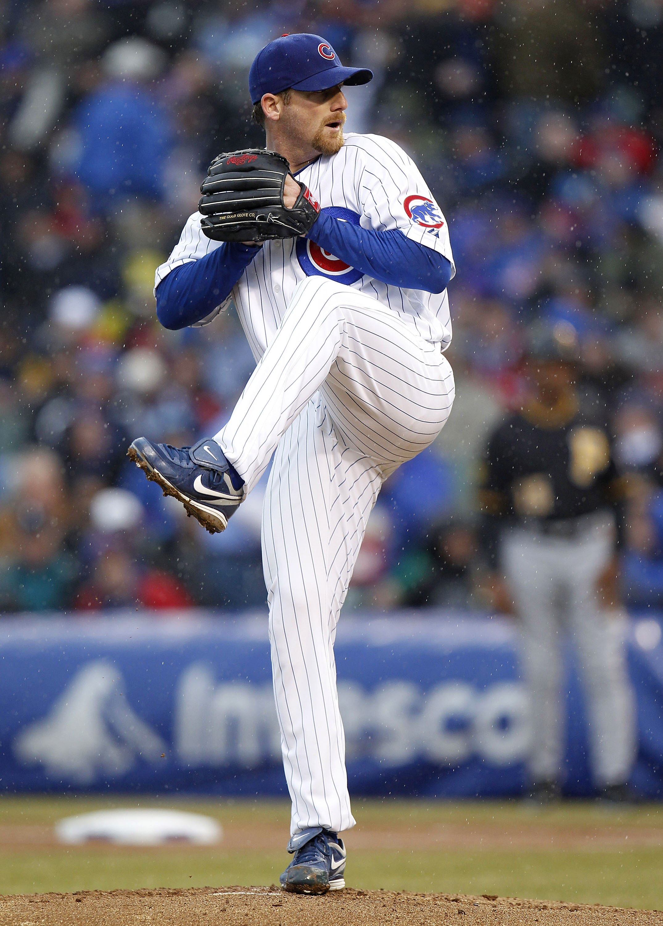 CHICAGO, IL - APRIL 01:  Ryan Dempster #36 of the Chicago Cubs throws a first inning pitch while playing the Pittsburgh Pirates during opening day at Wrigley Field on April 1, 2011 in Chicago, Illinois. Pittsburgh won the game 6-3. (Photo by Gregory Shamu