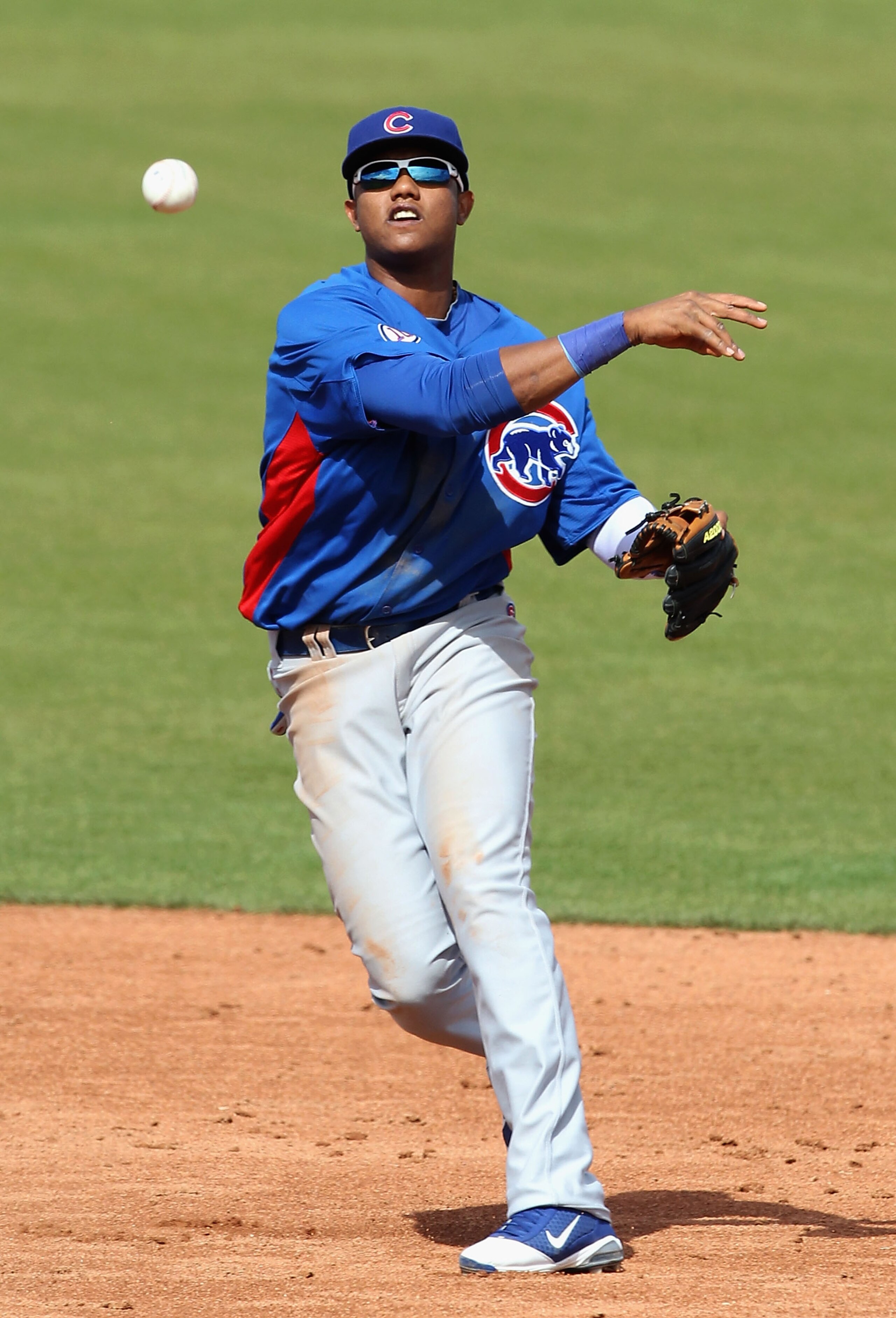 SCOTTSDALE, AZ - MARCH 01: Infielder Starlin Castro #13 of the Chicago Cubs throws to first base attempting to turn a double play during the spring training game against the San Francisco Giants at Scottsdale Stadium on March 1, 2011 in Scottsdale, Arizo SCOTTSDALE, AZ - MARCH 01: Infielder Starlin Castro #13 of the Chicago Cubs throws to first base attempting to turn a double play during the spring training game against the San Francisco Giants at Scottsdale Stadium on March 1, 2011 in Scottsdale, Arizo