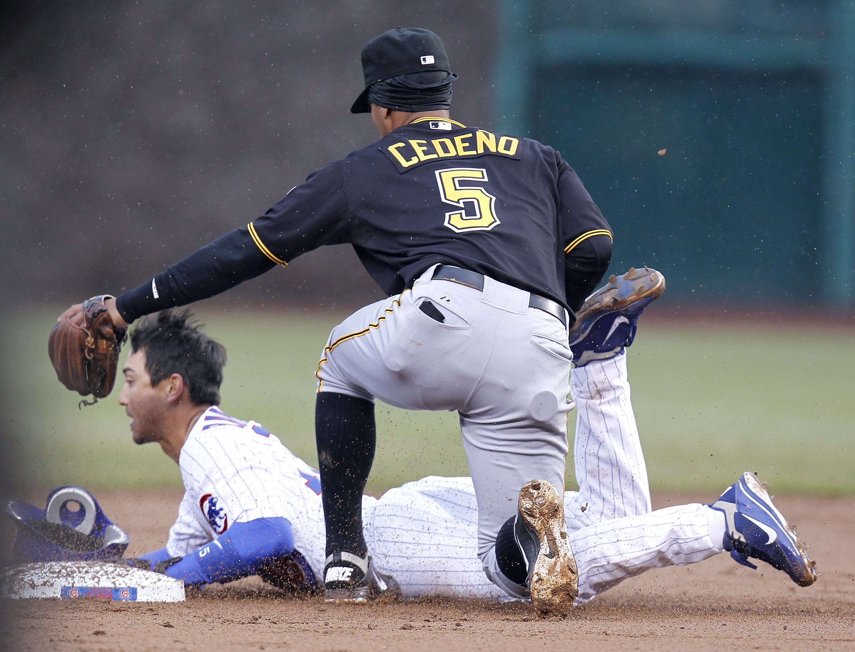 CHICAGO, IL - APRIL 01:  Geovany Soto #5 of the Pittsburgh Pirates tags out Darwin Barney #15 of the Chicago Cubs as he tries to steal second base during opening day at Wrigley Field on April 1, 2011 in Chicago, Illinois.  (Photo by Gregory Shamus/Getty I