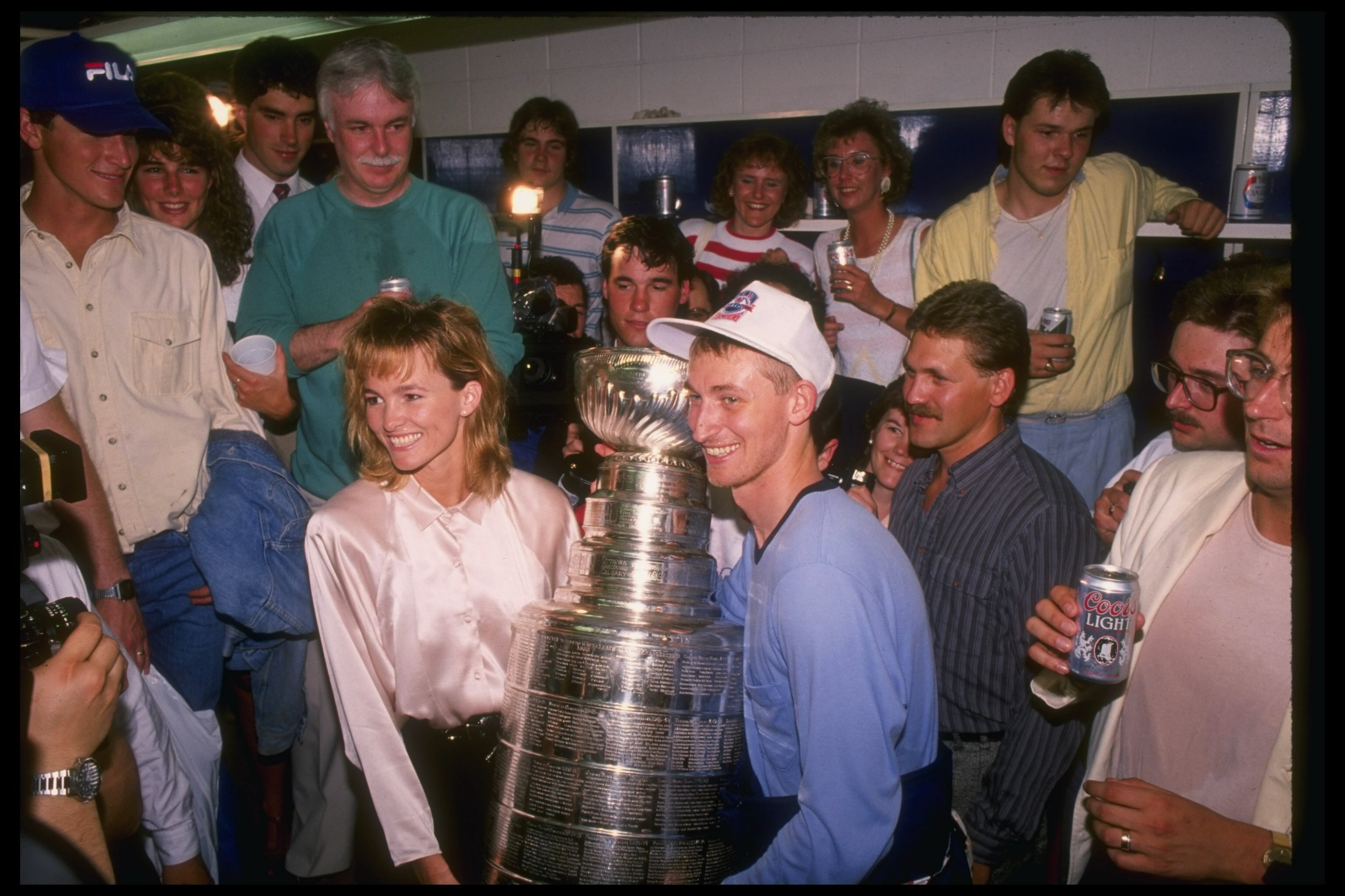 1988:  Center Wayne Gretzky of the Edmonton Oilers and his wife Janet pose with the Stanley Cup after sweeping the Boston Bruins 4-0. Mandatory Credit: Mike Powell  /Allsport