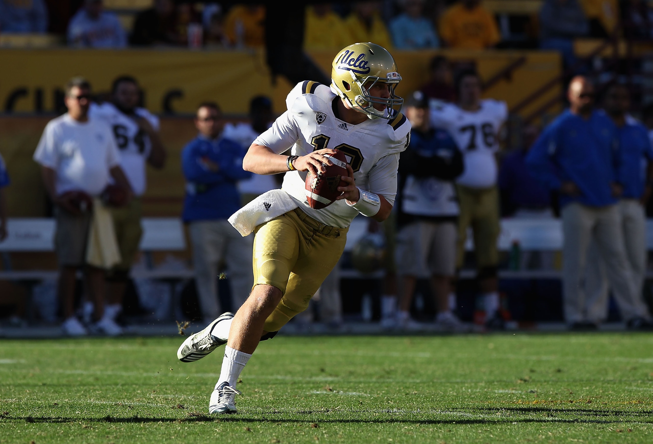 TEMPE, AZ - NOVEMBER 26: Quarterback Richard Brehaut #12 of the UCLA Bruins scrambles with the ball during the college football game against the Arizona State Sun Devils at Sun Devil Stadium on November 26, 2010 in Tempe, Arizona. The Sun Devils defeated TEMPE, AZ - NOVEMBER 26: Quarterback Richard Brehaut #12 of the UCLA Bruins scrambles with the ball during the college football game against the Arizona State Sun Devils at Sun Devil Stadium on November 26, 2010 in Tempe, Arizona. The Sun Devils defeated