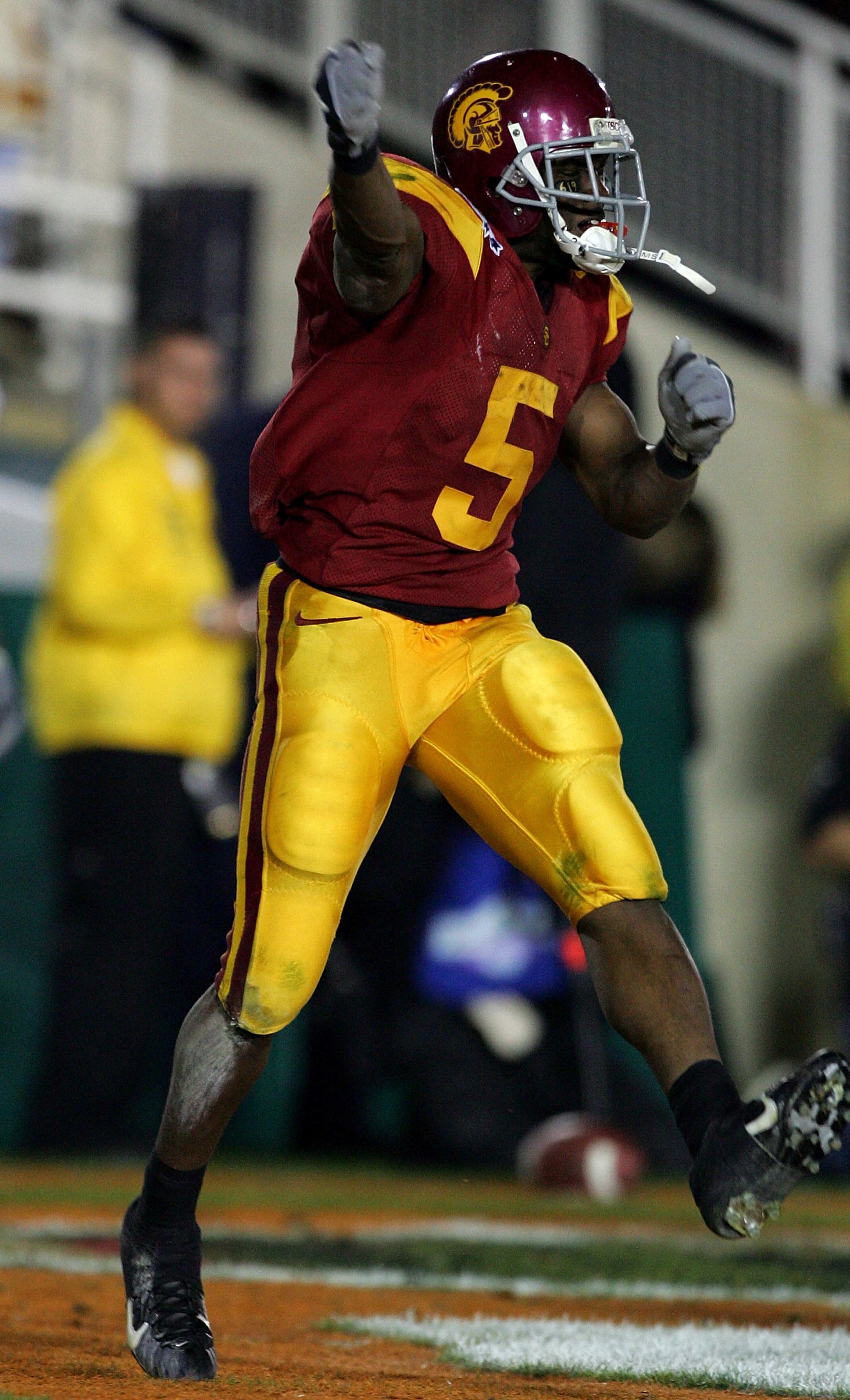 PASADENA, CA - JANUARY 04:  Reggie Bush #5 of the USC Trojans celebrates in the end zone after scoring a 26 yard touchdown in the fourth quarter of the BCS National Championship Rose Bowl Game against the Texas Longhorns at the Rose Bowl on January 4, 200