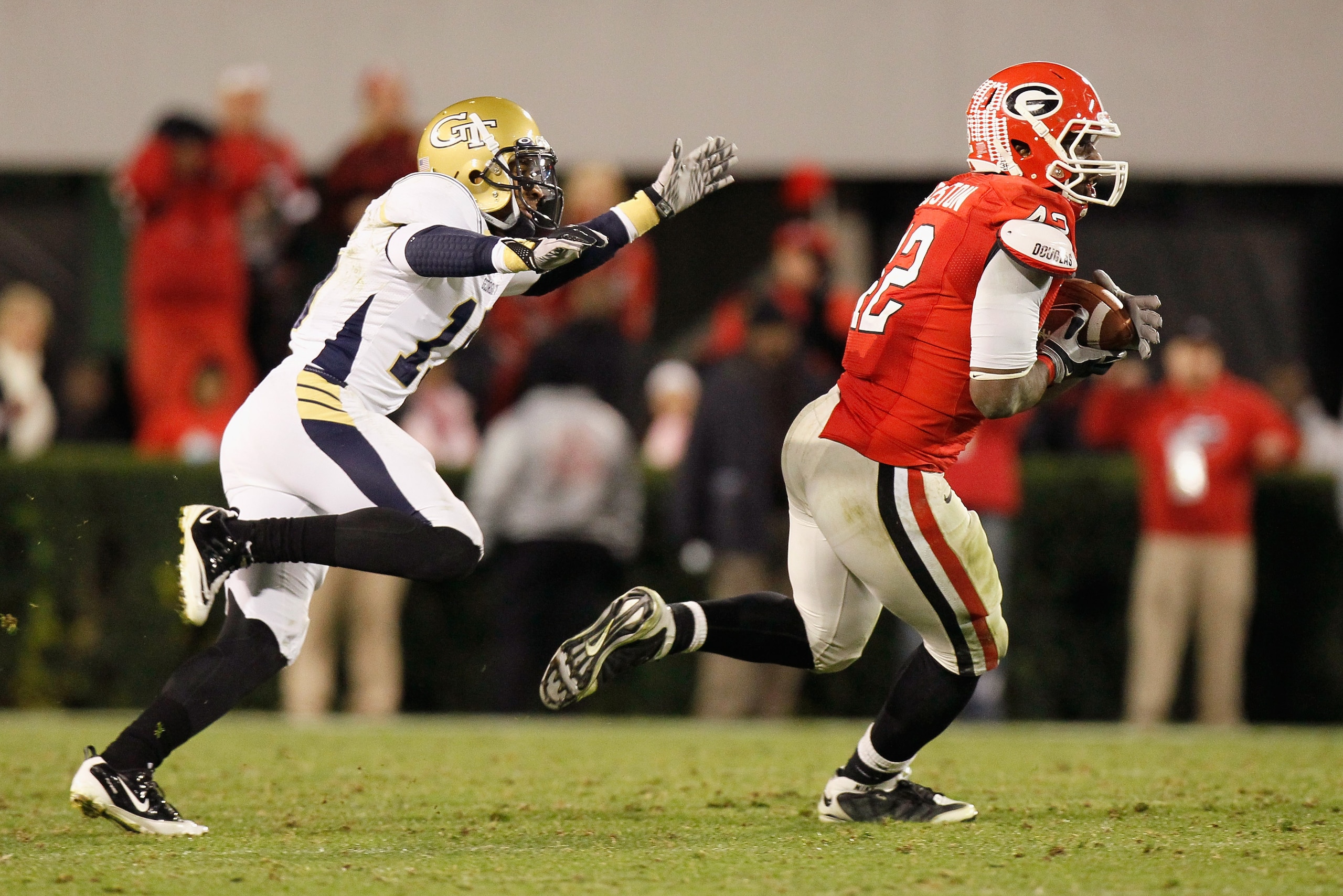ATHENS, GA - NOVEMBER 27: Justin Houston #42 of the Georgia Bulldogs intercepts a pass intended for Correy Earls #15 of the Georgia Tech Yellow Jackets in the final seconds of regulation at Sanford Stadium on November 27, 2010 in Athens, Georgia. (Photo ATHENS, GA - NOVEMBER 27: Justin Houston #42 of the Georgia Bulldogs intercepts a pass intended for Correy Earls #15 of the Georgia Tech Yellow Jackets in the final seconds of regulation at Sanford Stadium on November 27, 2010 in Athens, Georgia. (Photo