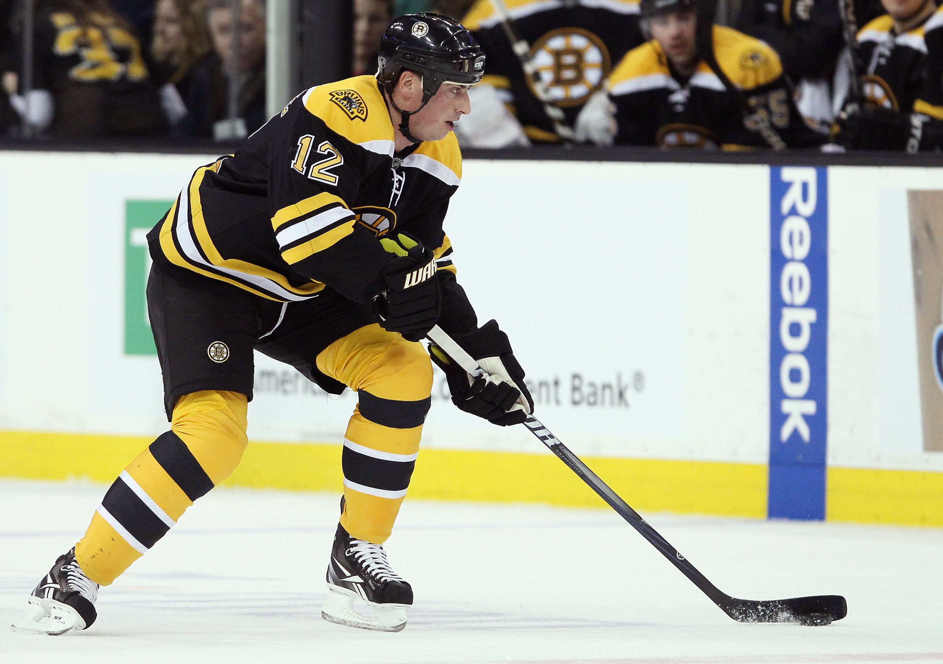 BOSTON, MA - MARCH 24:  Tomas Kaberle #12 of the Boston Bruins takes the puck in the first period against the Montreal Canadiens on March 24, 2011 at the TD Garden in Boston, Massachusetts.  (Photo by Elsa/Getty Images)