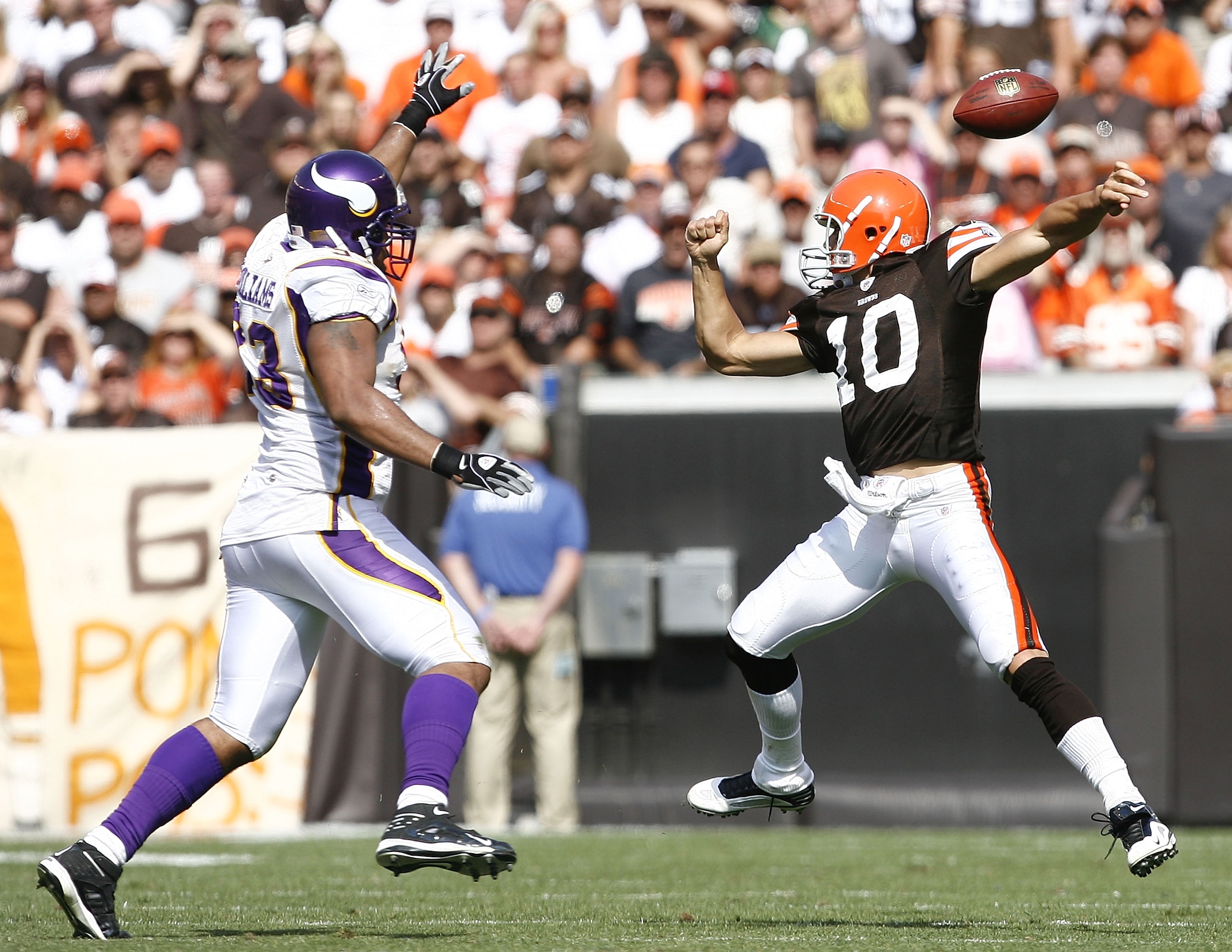 CLEVELAND - SEPTEMBER 13:  Brady Quinn #10 of the Cleveland Browns fumbles the ball as he is pressured by Kevin Williams #93 of the Minnesota Vikings at Cleveland Browns Stadium on September 13, 2009 in Cleveland, Ohio.  (Photo by Matt Sullivan/Getty Imag