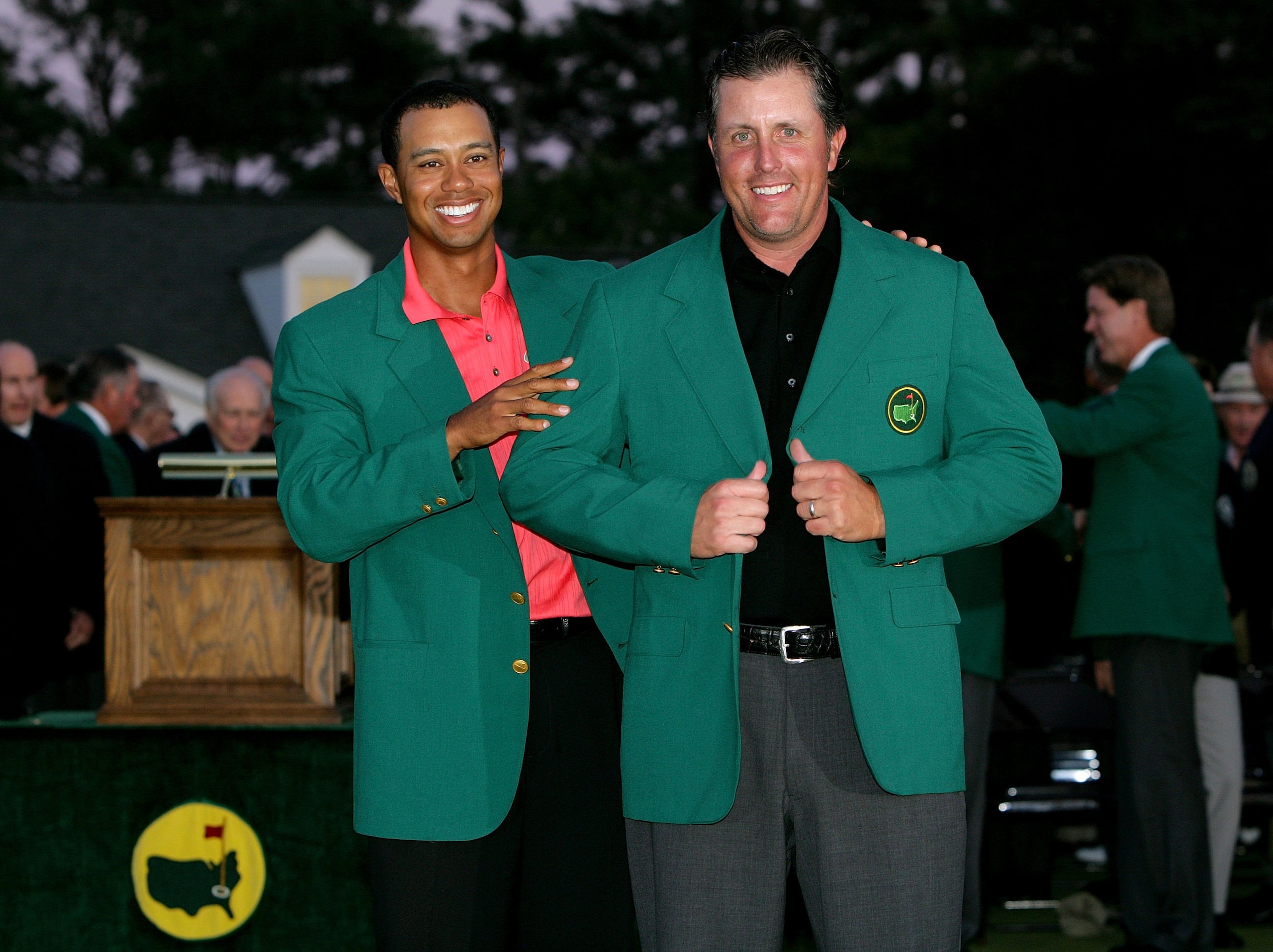 AUGUSTA, GA - APRIL 09:  Tiger Woods and Phil Mickelson pose after Woods put the green jacket on Mickelson after winning The Masters at the Augusta National Golf Club after the final round on April 9, 2006 in Augusta, Georgia.   Mickelson won with the sco