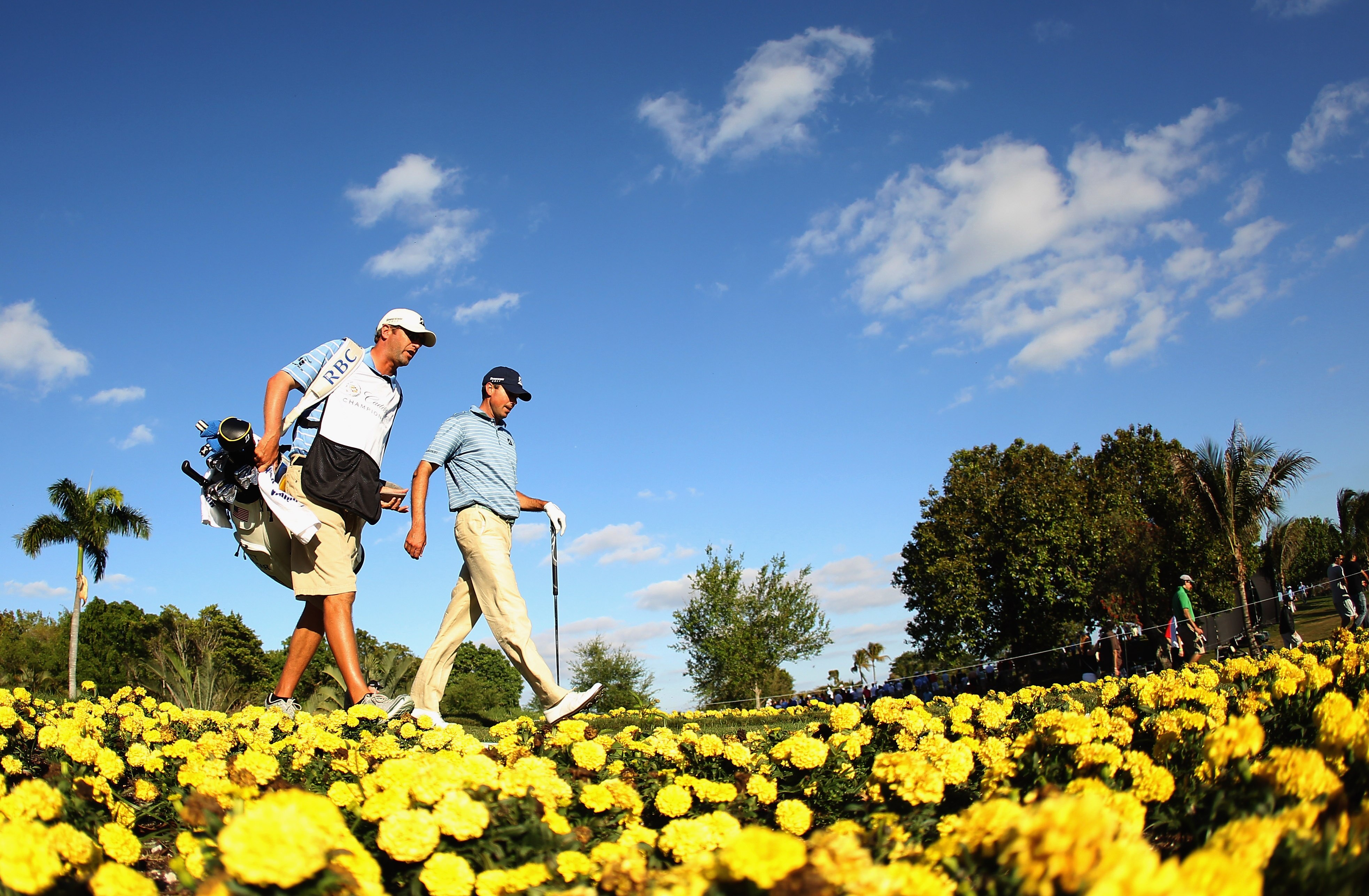 DORAL, FL - MARCH 13:  Matt Kuchar walks off the 15th tee with his caddie Lance Bennett during the final round of the 2011 WGC- Cadillac Championship at the TPC Blue Monster at the Doral Golf Resort and Spa on March 13, 2011 in Doral, Florida.  (Photo by