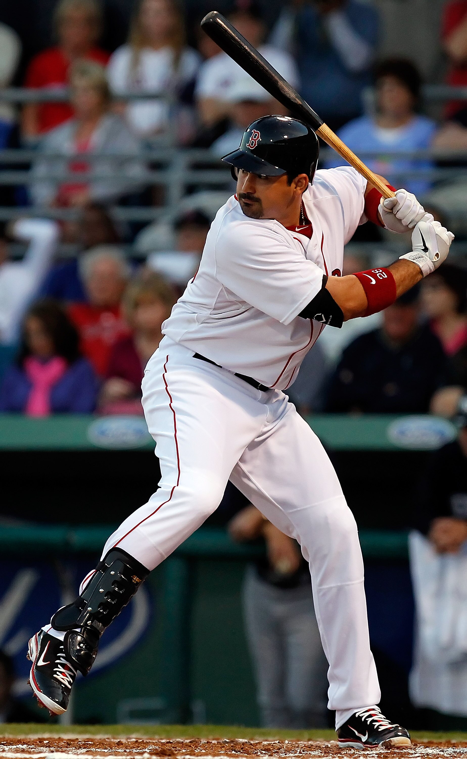 FORT MYERS, FL - MARCH 14:  Infielder Adrian Gonzalez #28 of the Boston Red Sox bats against the New York Yankees during a Grapefruit League Spring Training Game at City of Palms Park on March 14, 2011 in Fort Myers, Florida.  (Photo by J. Meric/Getty Ima