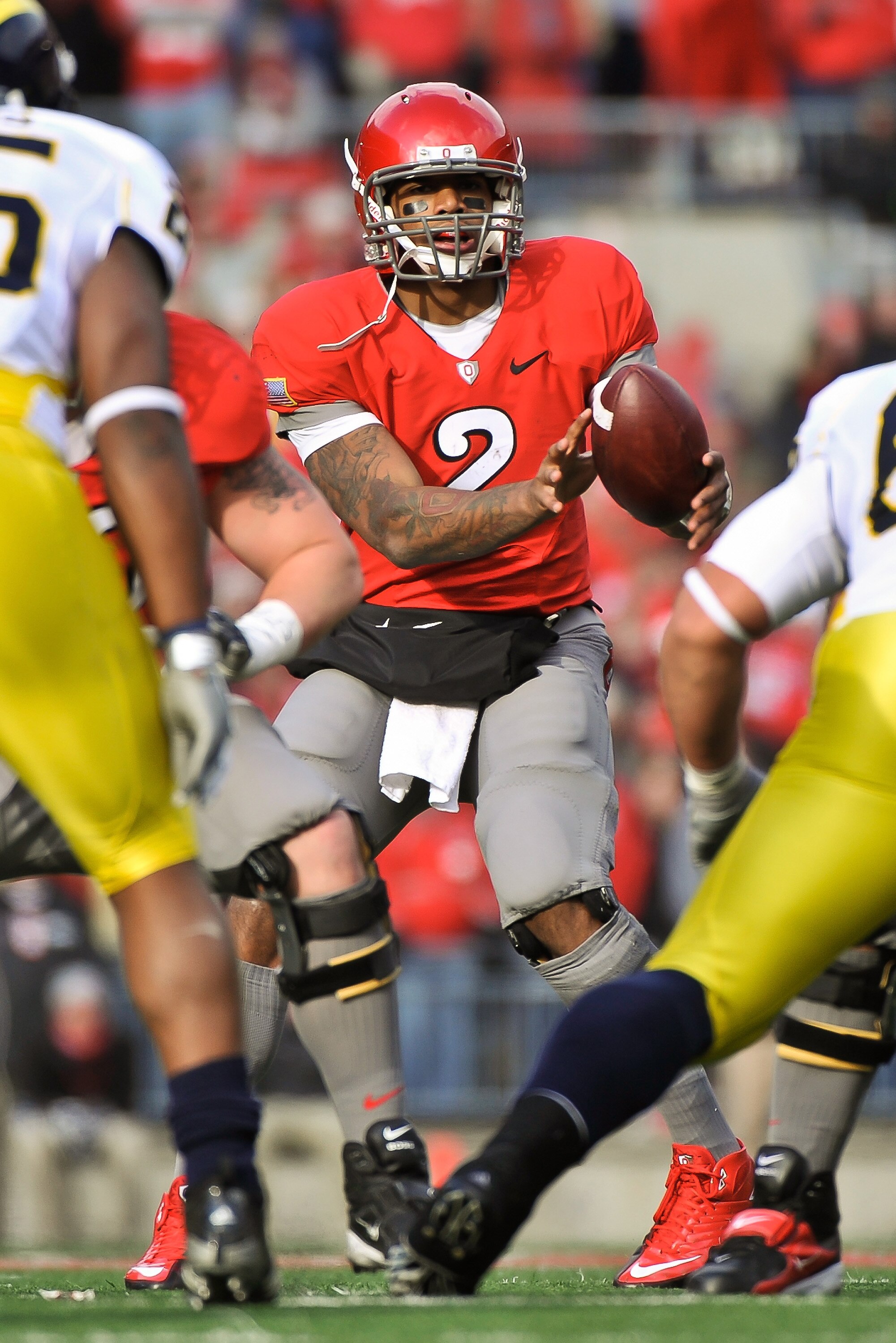COLUMBUS, OH - NOVEMBER 27:  Quarterback Terrelle Pryor #2 of the Ohio State Buckeyes takes the snap from the center against the Michigan Wolverines at Ohio Stadium on November 27, 2010 in Columbus, Ohio.  (Photo by Jamie Sabau/Getty Images)