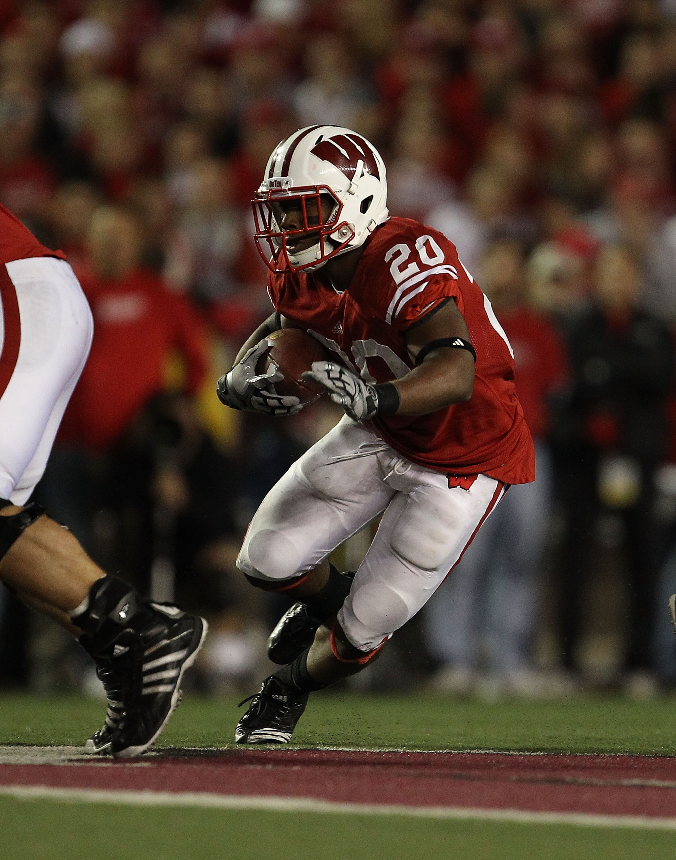MADISON, WI - OCTOBER 16: James White #20 of the Wisconsin Badgers runs against the Ohio State Buckeyes at Camp Randall Stadium on October 16, 2010 in Madison, Wisconsin. Wisconsin defeated Ohio State 31-18. (Photo by Jonathan Daniel/Getty Images)