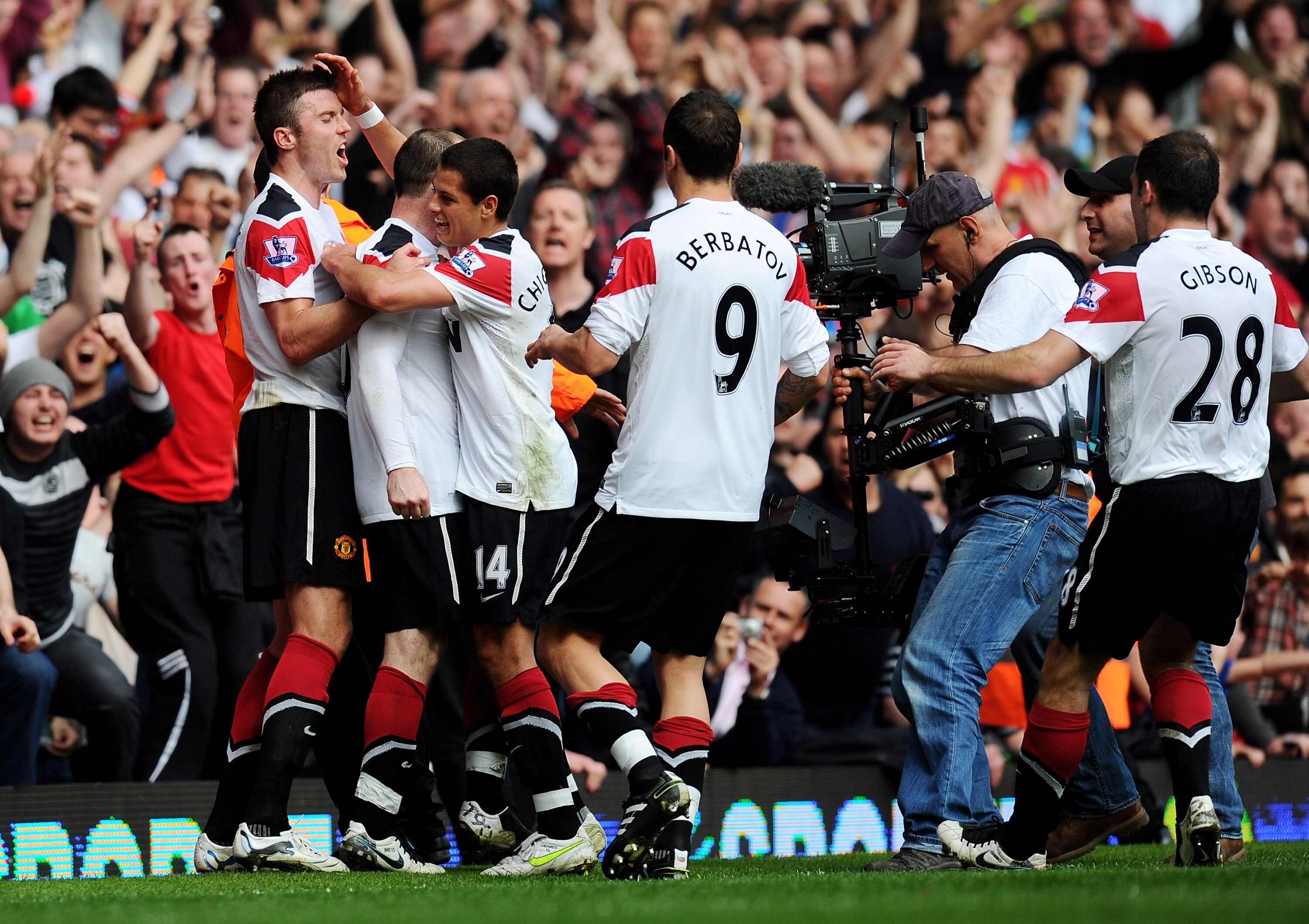 LONDON, ENGLAND - APRIL 02:  Wayne Rooney (2ndL) of Manchester United is mobbed by team mates after scoring his hat trick goal from the penalty spot during the Barclays Premier League match between West Ham United and Manchester United at the Boleyn Groun