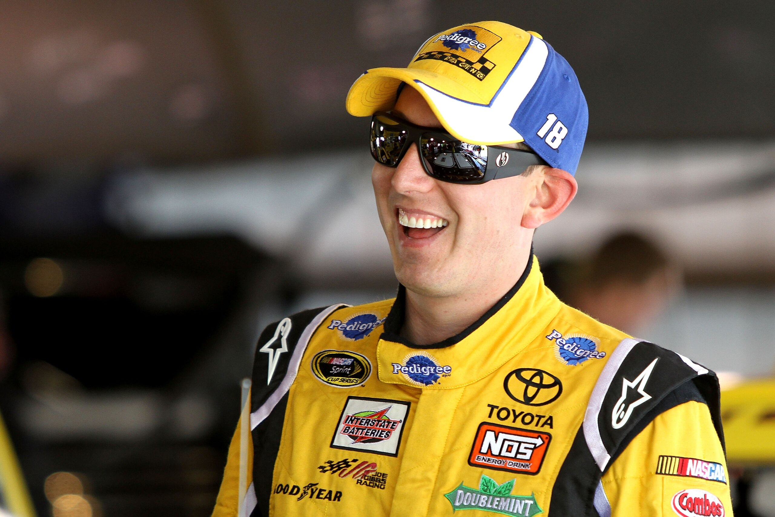 MARTINSVILLE, VA - APRIL 01: Kyle Busch, driver of the #18 Pedigree Toyota, stands in the garage during practice for the NASCAR Sprint Cup Series Goody's Fast Relief 500 at Martinsville Speedway on April 1, 2011 in Martinsville, Virginia. (Photo by Jerr MARTINSVILLE, VA - APRIL 01: Kyle Busch, driver of the #18 Pedigree Toyota, stands in the garage during practice for the NASCAR Sprint Cup Series Goody's Fast Relief 500 at Martinsville Speedway on April 1, 2011 in Martinsville, Virginia. (Photo by Jerr