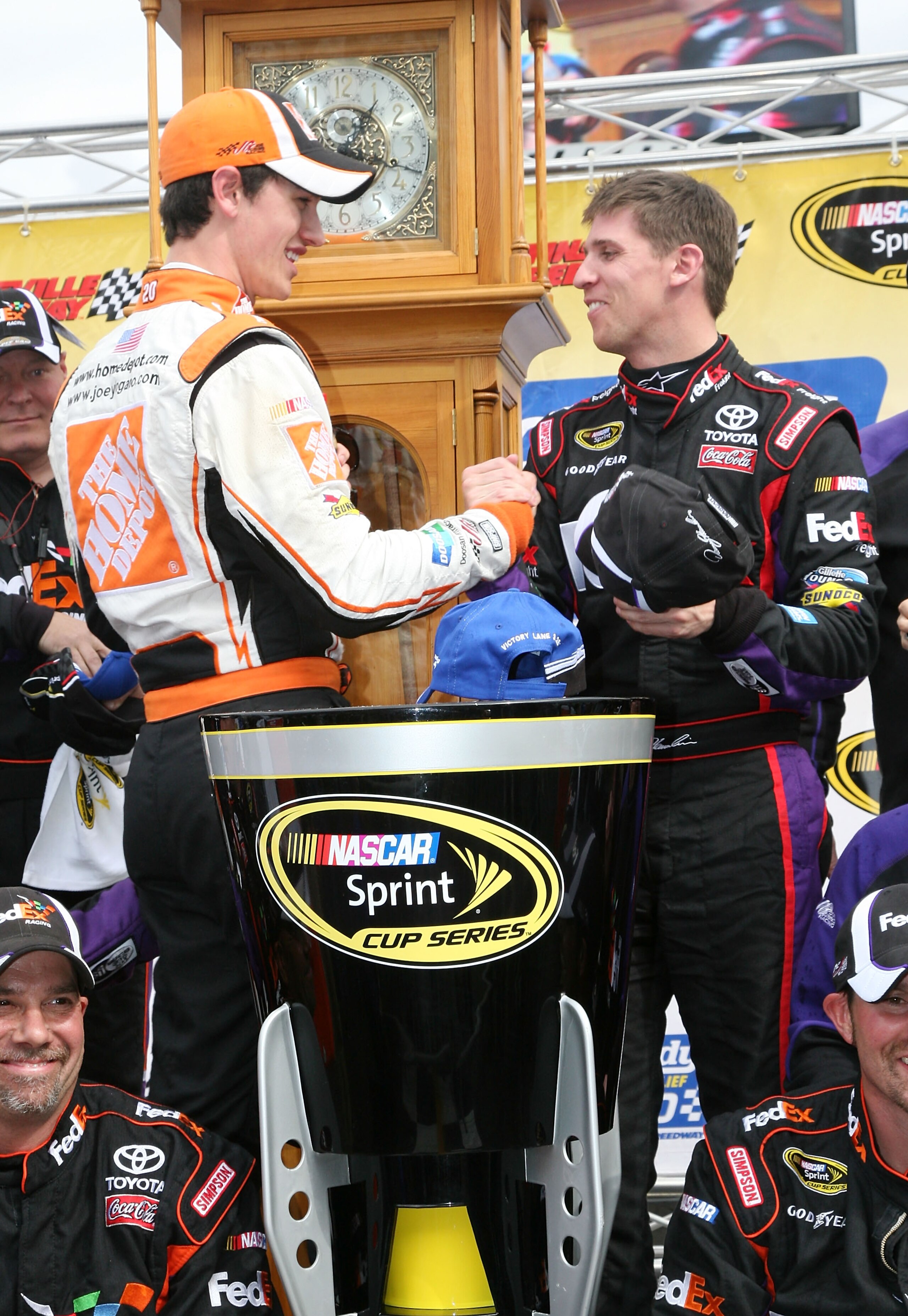 MARTINSVILLE, VA - MARCH 29: Joey Logano, driver of the #20 Home Depot Toyota congratulates Denny Hamlin, driver of the #11 FedEx Toyota after his win in the NASCAR Sprint Cup Series Goody's Fast Pain Relief 500 at Martinsville Speedway on March 29, 2010 MARTINSVILLE, VA - MARCH 29: Joey Logano, driver of the #20 Home Depot Toyota congratulates Denny Hamlin, driver of the #11 FedEx Toyota after his win in the NASCAR Sprint Cup Series Goody's Fast Pain Relief 500 at Martinsville Speedway on March 29, 2010