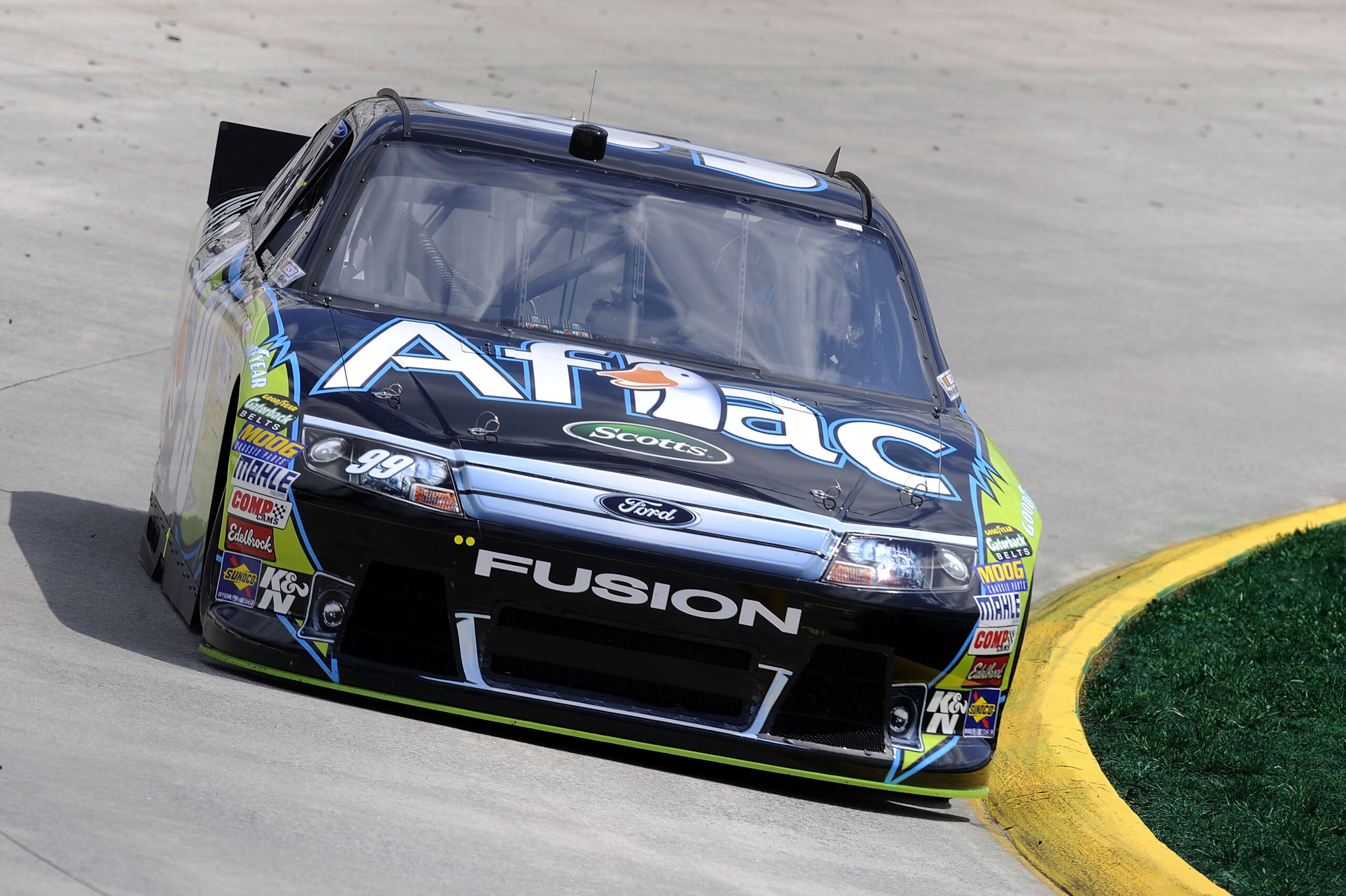MARTINSVILLE, VA - APRIL 01: Carl Edwards drives the #99 Aflac Ford during practice for the NASCAR Sprint Cup Series Goody's Fast Relief 500 at Martinsville Speedway on April 1, 2011 in Martinsville, Virginia. (Photo by John Harrelson/Getty Images for N MARTINSVILLE, VA - APRIL 01: Carl Edwards drives the #99 Aflac Ford during practice for the NASCAR Sprint Cup Series Goody's Fast Relief 500 at Martinsville Speedway on April 1, 2011 in Martinsville, Virginia. (Photo by John Harrelson/Getty Images for N