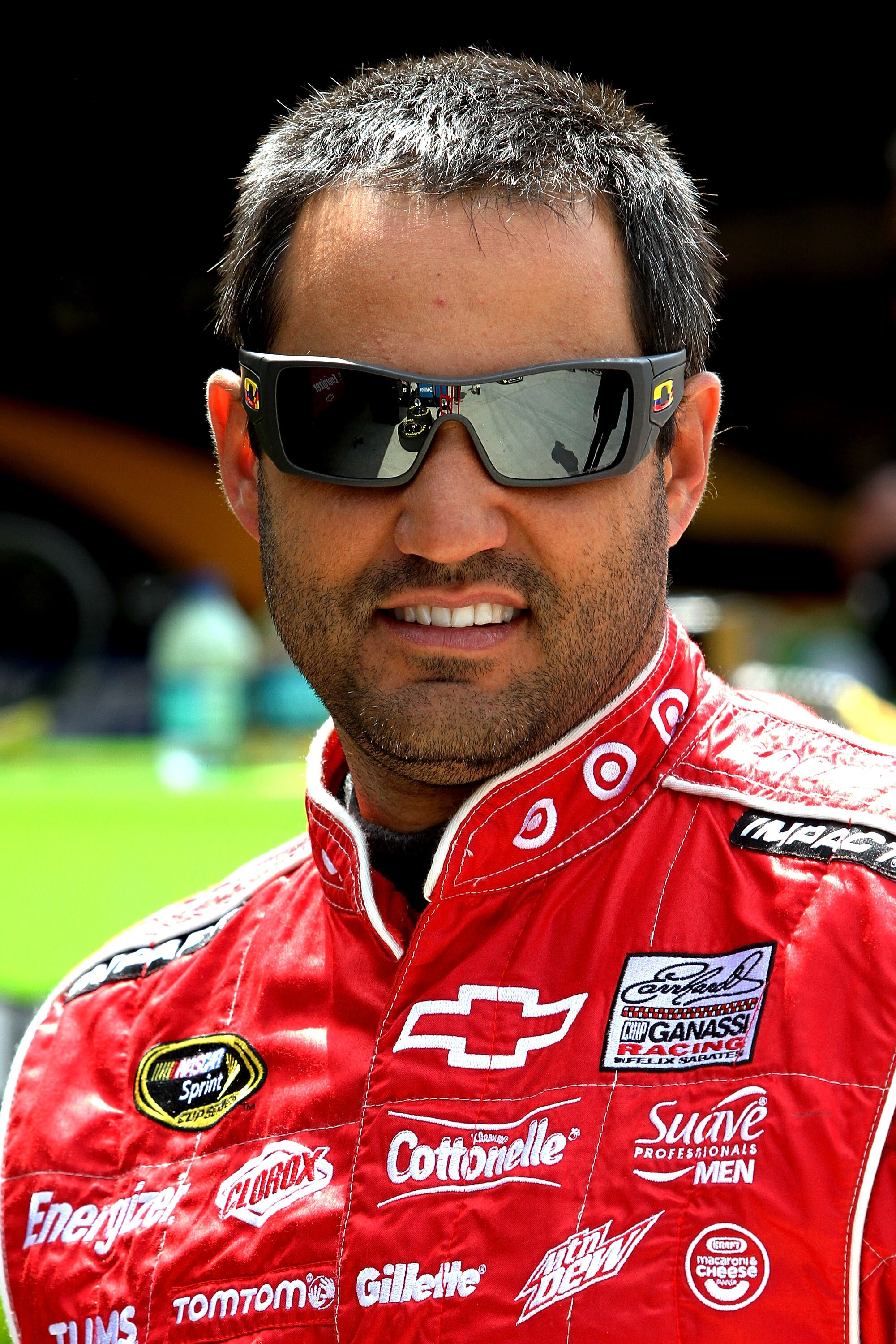MARTINSVILLE, VA - APRIL 01:  Juan Pablo Montoya, driver of the #42 Target Chevrolet, stands in the garage area during practice for the NASCAR Sprint Cup Series Goody's Fast Relief 500 at Martinsville Speedway on April 1, 2011 in Martinsville, Virginia.