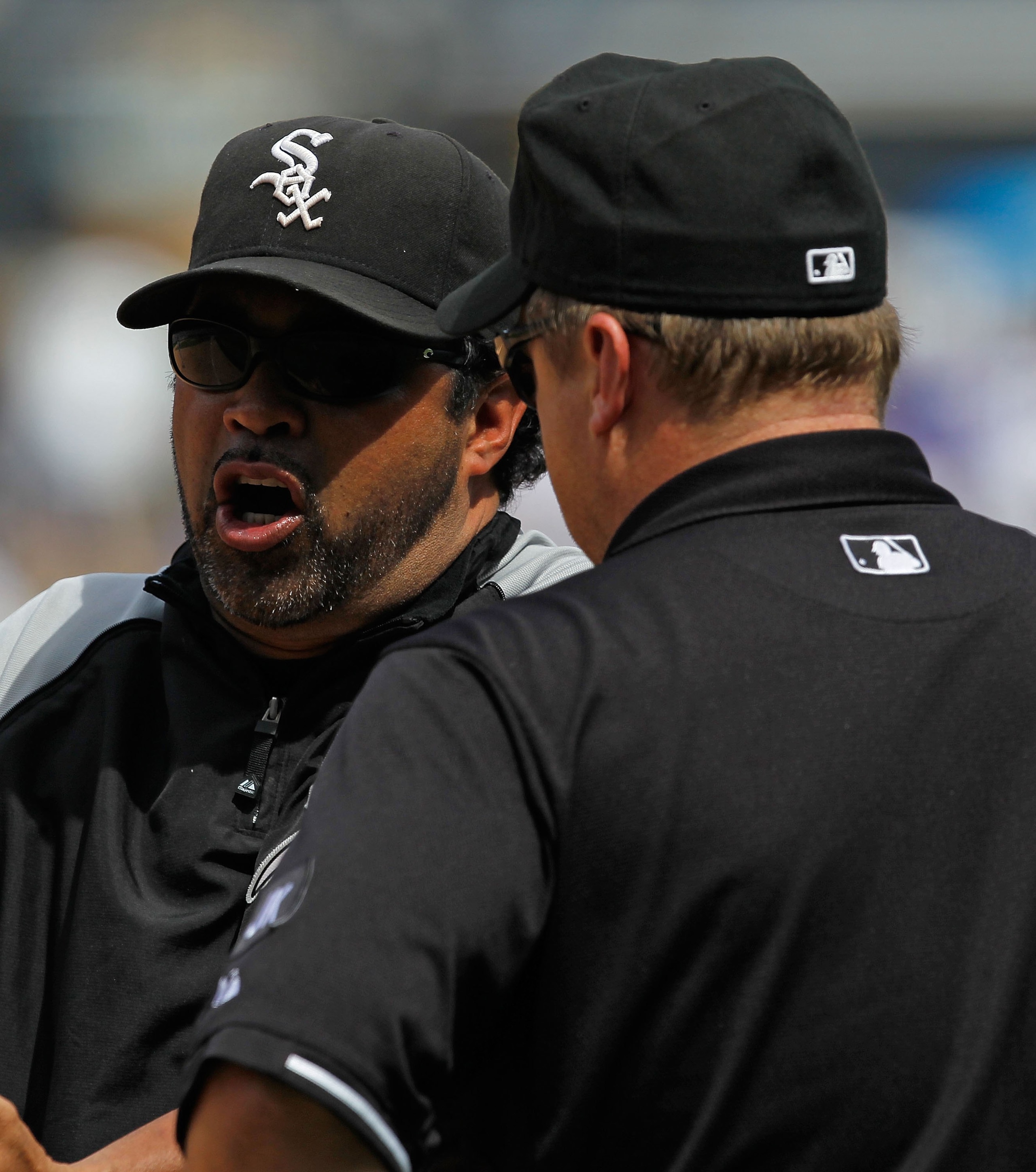 CHICAGO - JUNE 27: Manager Ozzie Guillen #13 of the Chicago White Sox argues a call with 1st base umpire Bruce Dreckman #1 during a game against the Chicago Cubs at U.S. Cellular Field on June 27, 2010 in Chicago, Illinois. The Cubs defeated the White Sox