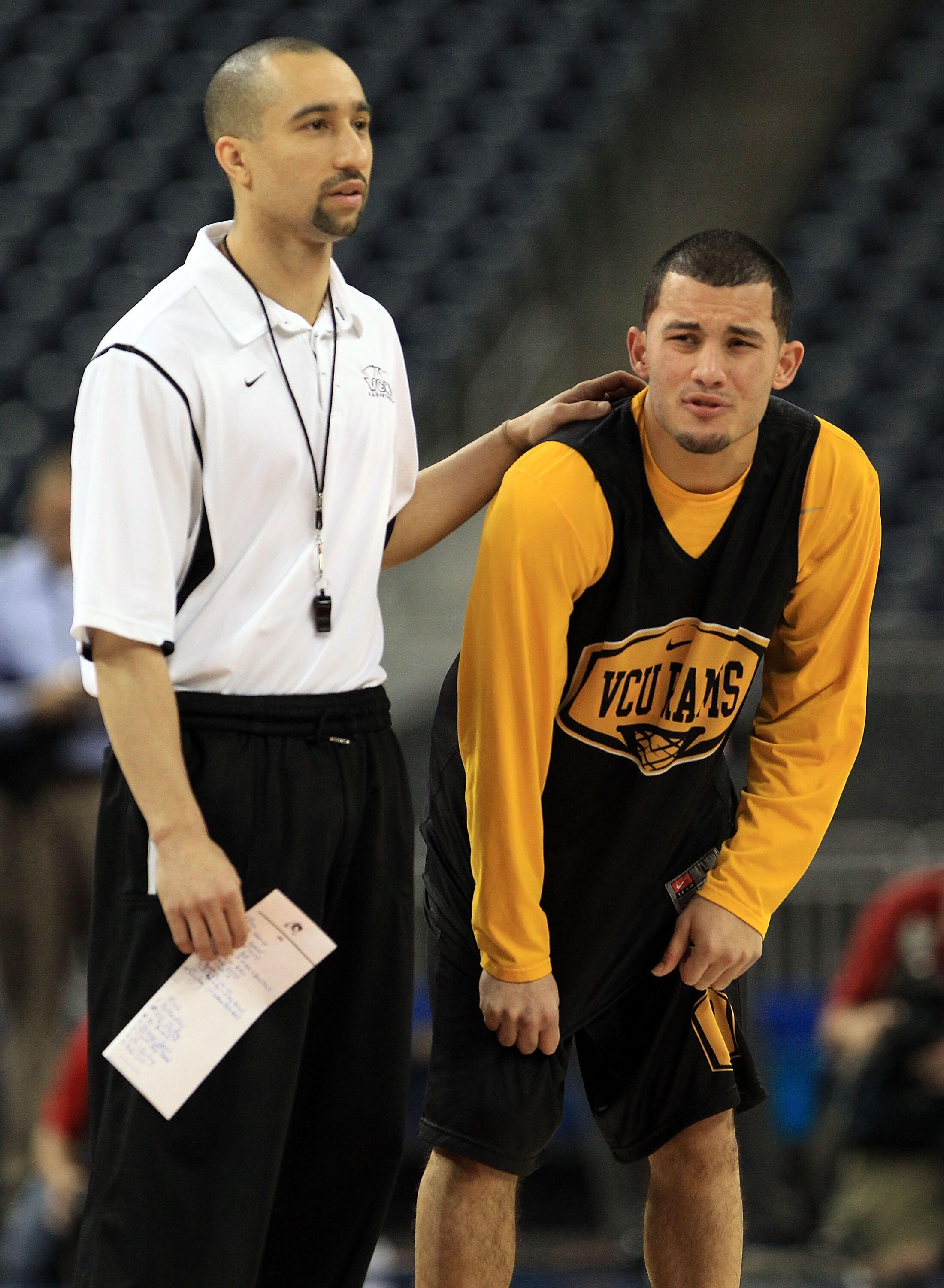 HOUSTON, TX - APRIL 01:  Head coach Shaka Smart of the Virginia Commonwealth Rams stands with Joey Rodriguez #12 during practice prior to the 2011 Final Four of the NCAA Division I Men's Basketball Tournament at Reliant Stadium on April 1, 2011 in Houston