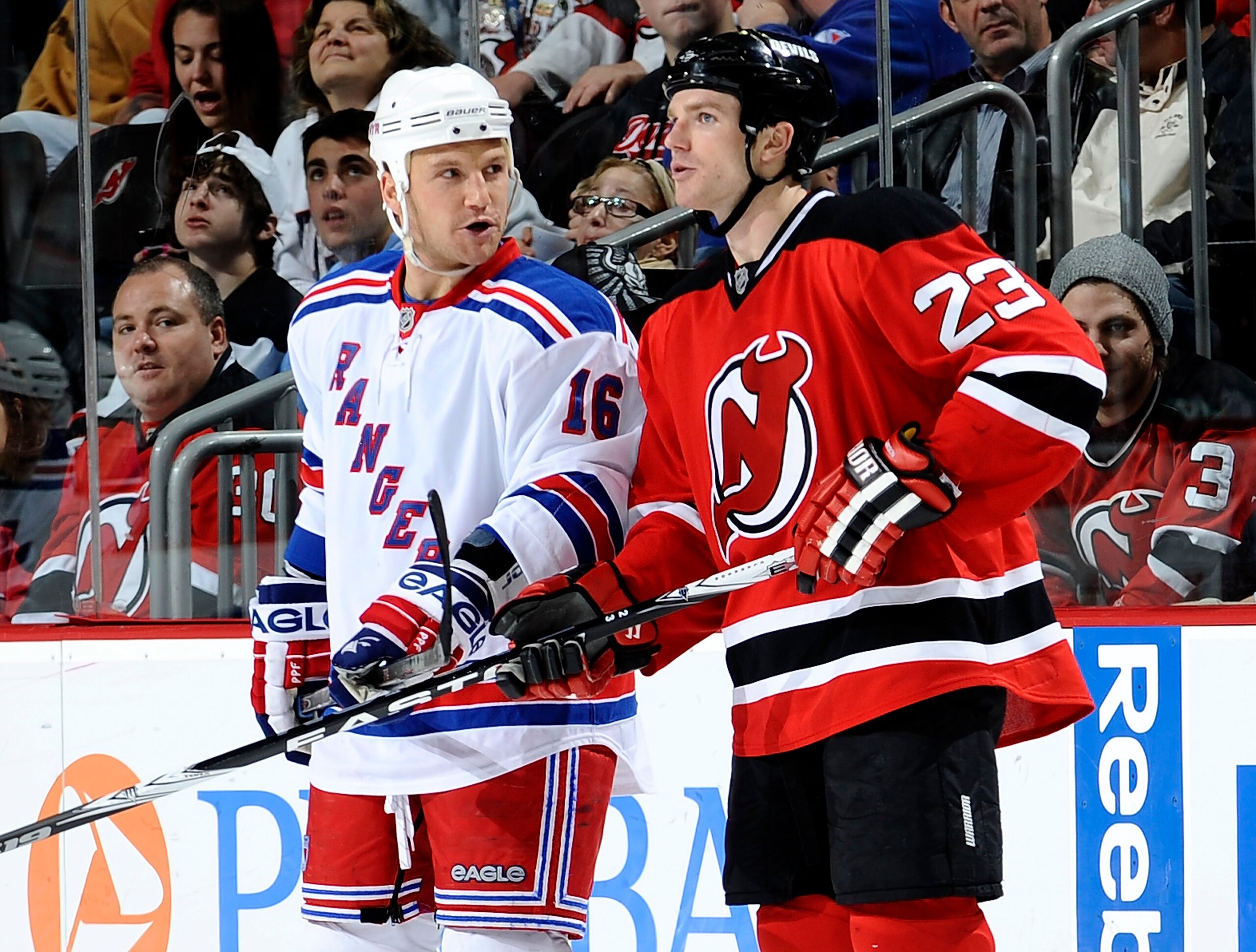 NEWARK, NJ - MARCH 25:  Sean Avery #16 of the New York Rangers talks to David Clarkson #23 of the New Jersey Devils  at the Prudential Center on March 25, 2010 in Newark, New Jersey.  The Rangers won 4-3 in a shootout. (Photo by Jeff Zelevansky/Getty Imag