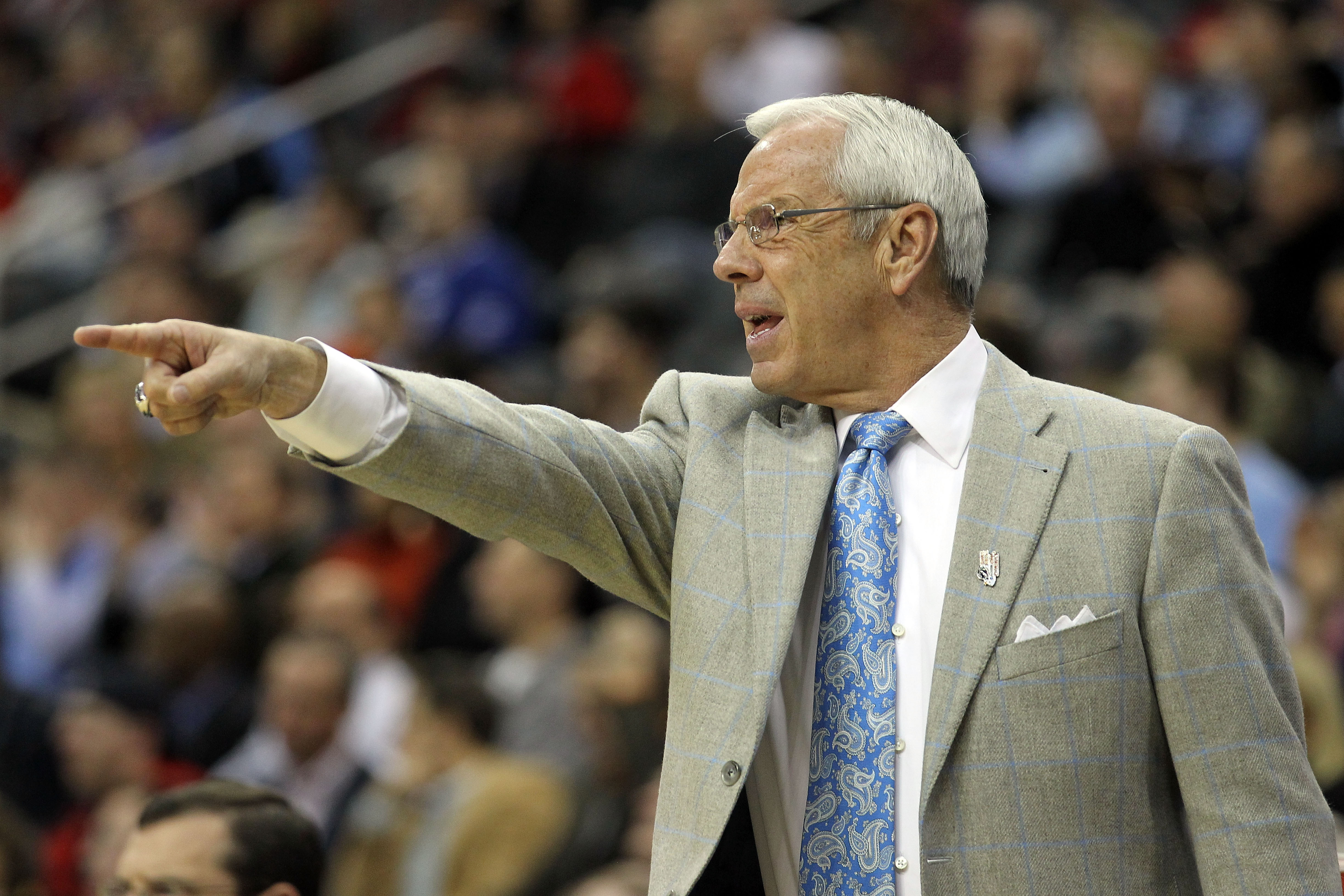 NEWARK, NJ - MARCH 25:  Head coach Roy Williams of the North Carolina Tar Heels points to the court during the first half of the east regional semifinal of the 2011 NCAA Men's Basketball Tournament at the Prudential Center on March 25, 2011 in Newark, New