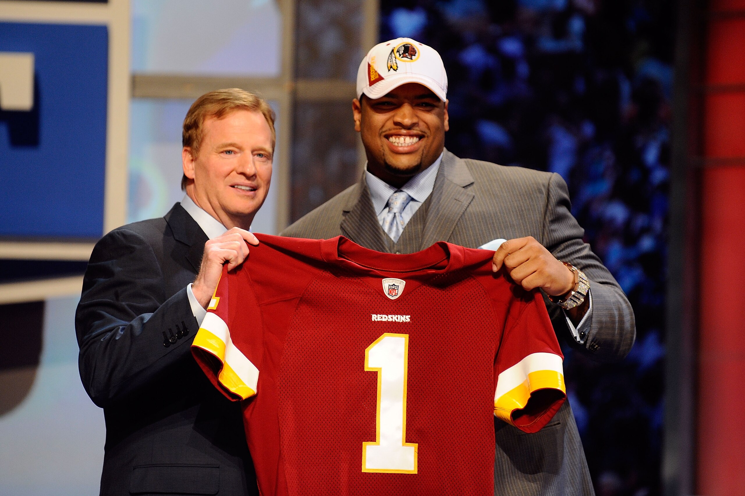 NEW YORK - APRIL 22:  Trent Williams (R) of the Oklahoma Sooners poses with NFL Commissoner Roger Goodell as they hold a Washington Redskins jersey after Washington selected Williams #4 overall during the 2010 NFL Draft at Radio City Music Hall on April 2