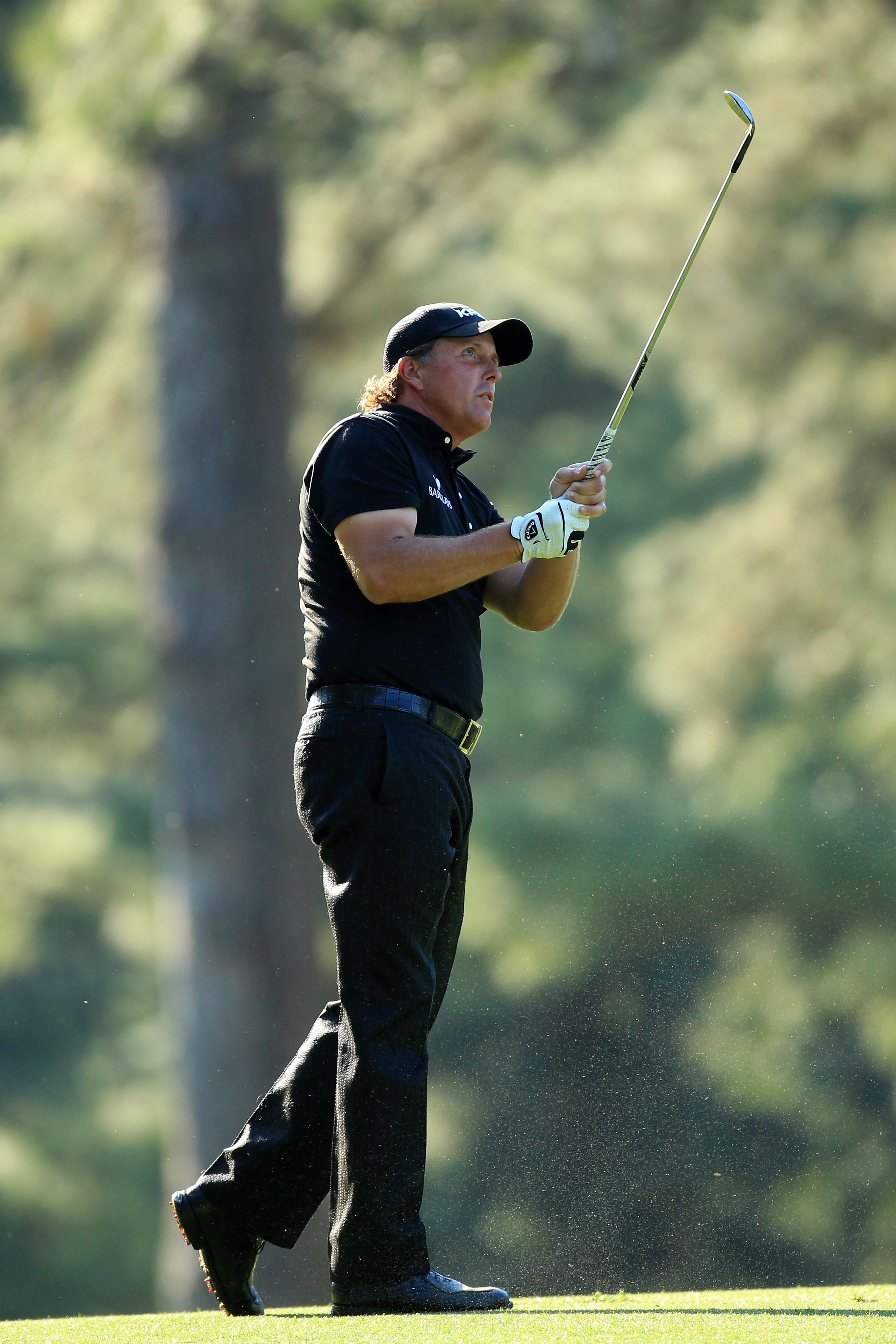AUGUSTA, GA - APRIL 11:  Phil Mickelson watches a shot on the 14th hole during the final round of the 2010 Masters Tournament at Augusta National Golf Club on April 11, 2010 in Augusta, Georgia.  (Photo by David Cannon/Getty Images)