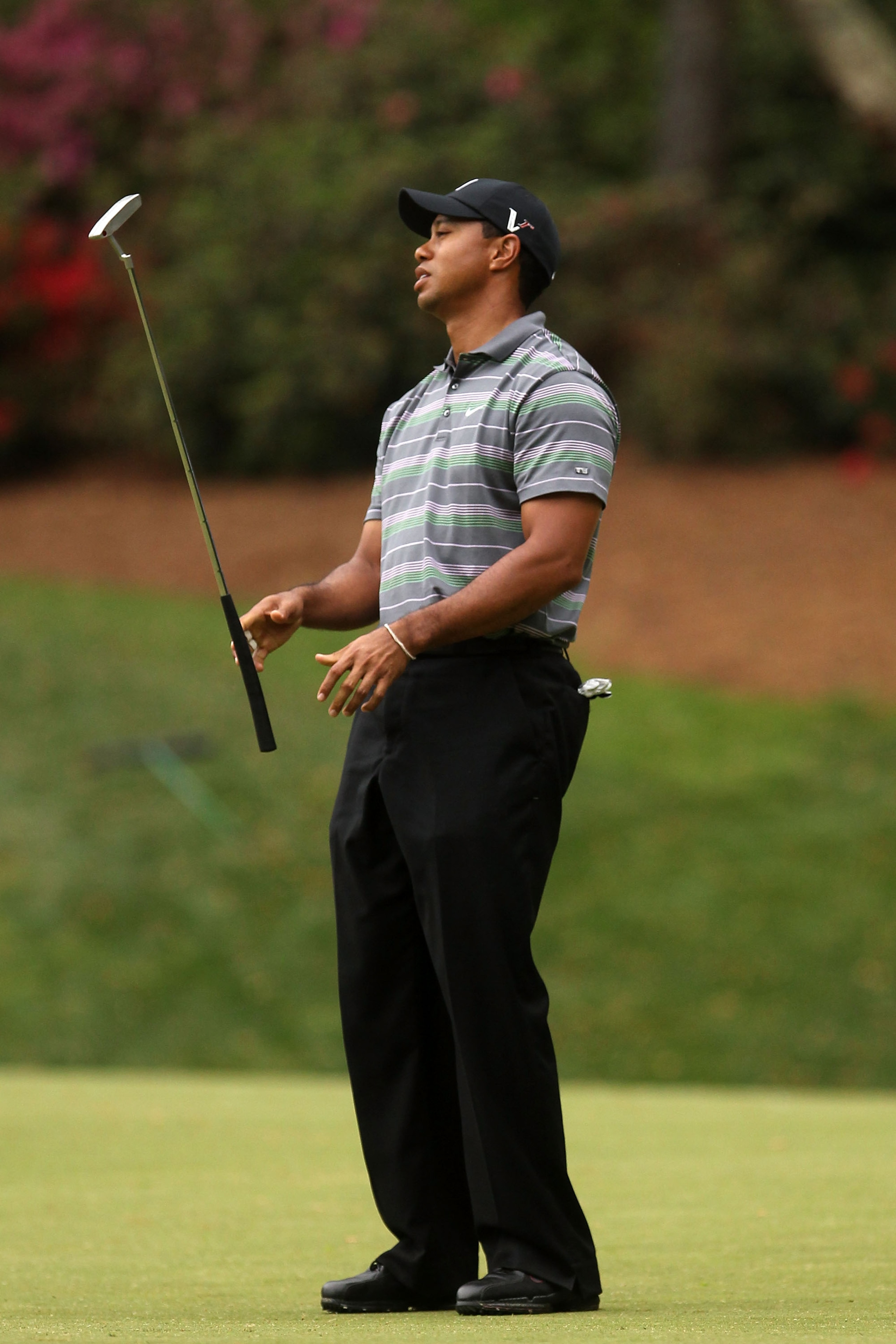 AUGUSTA, GA - APRIL 08:  Tiger Woods reacts to missing an eagle putt on the 13th hole during the first round of the 2010 Masters Tournament at Augusta National Golf Club on April 8, 2010 in Augusta, Georgia.  (Photo by Andrew Redington/Getty Images)