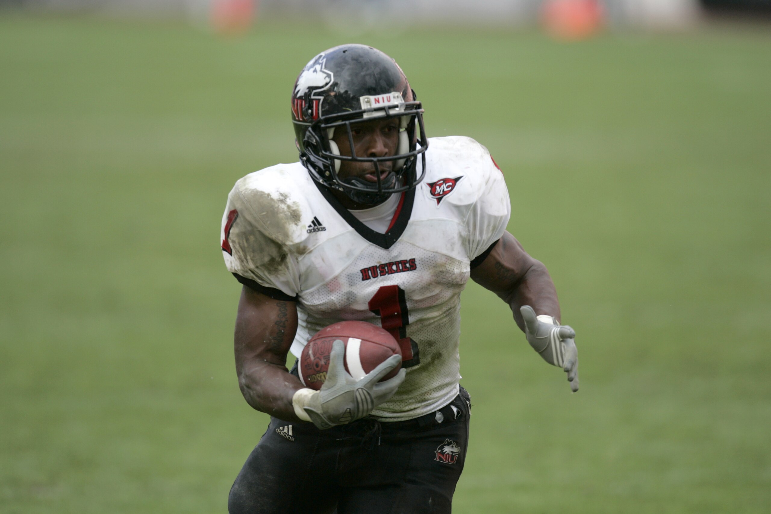 COLUMBUS, OH - SEPTEMBER 2: Tailback Garrett Wolfe #1 of the Northern Illinois University Huskies carries the ball against the Ohio State University Buckeyes during the game on September 2, 2006 at Ohio Stadium in Columbus, Ohio. OSU won 35-12. (Photo B COLUMBUS, OH - SEPTEMBER 2: Tailback Garrett Wolfe #1 of the Northern Illinois University Huskies carries the ball against the Ohio State University Buckeyes during the game on September 2, 2006 at Ohio Stadium in Columbus, Ohio. OSU won 35-12. (Photo B