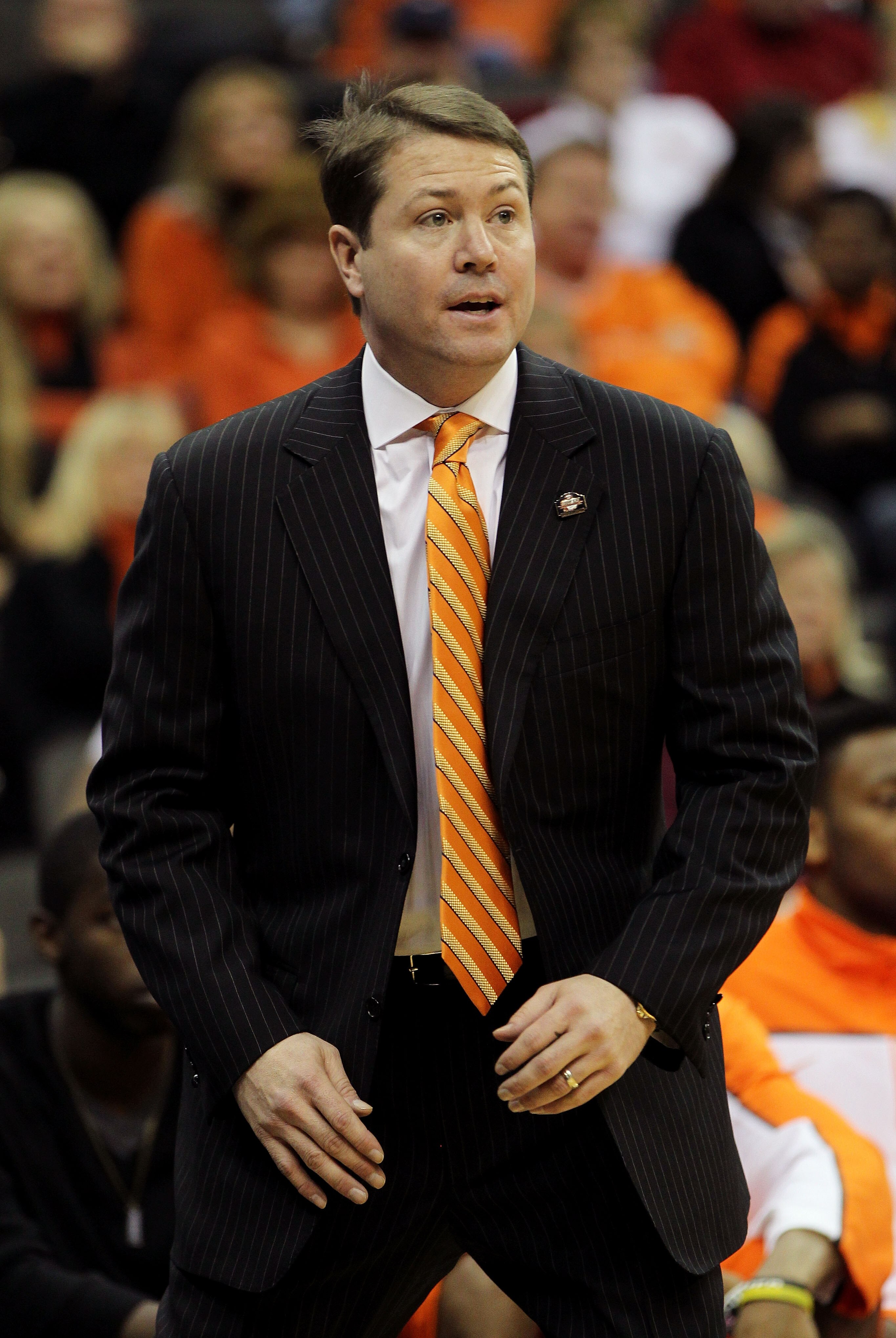 KANSAS CITY, MO - MARCH 09:  head coach Travis Ford of the Oklahoma State Cowboys looks on from the sidelines in the first half against the Nebraska Cornhuskers during the first round of the 2011 Phillips 66 Big 12 Men's Basketball Tournament at Sprint Ce