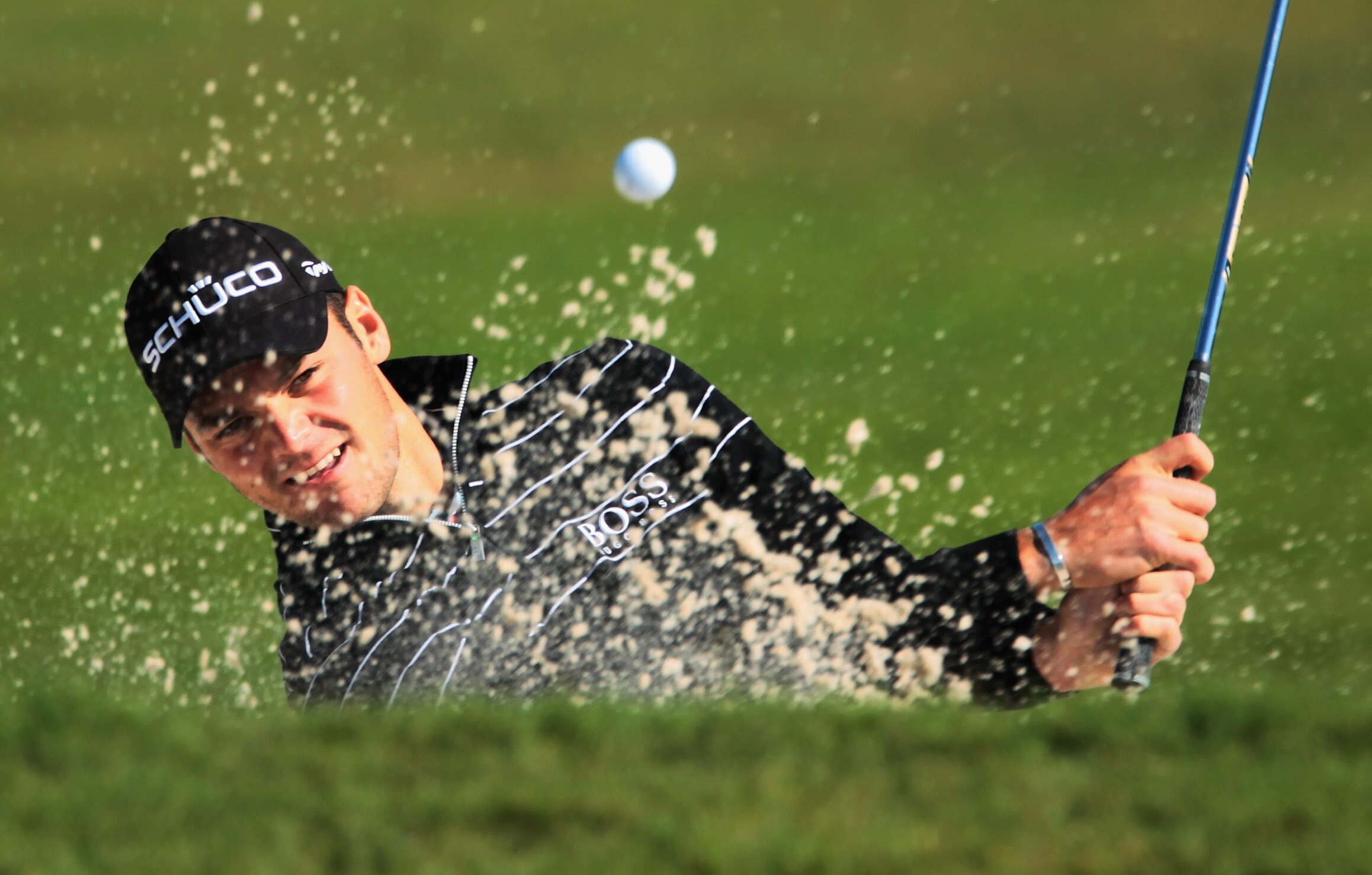 DORAL, FL - MARCH 11: Martin Kaymer of Germany plays a bunker shot on the 15th hole during the completion of the first round of the 2011 WGC- Cadillac Championship at the TPC Blue Monster at the Doral Golf Resort and Spa on March 11, 2011 in Doral, Flori DORAL, FL - MARCH 11: Martin Kaymer of Germany plays a bunker shot on the 15th hole during the completion of the first round of the 2011 WGC- Cadillac Championship at the TPC Blue Monster at the Doral Golf Resort and Spa on March 11, 2011 in Doral, Flori