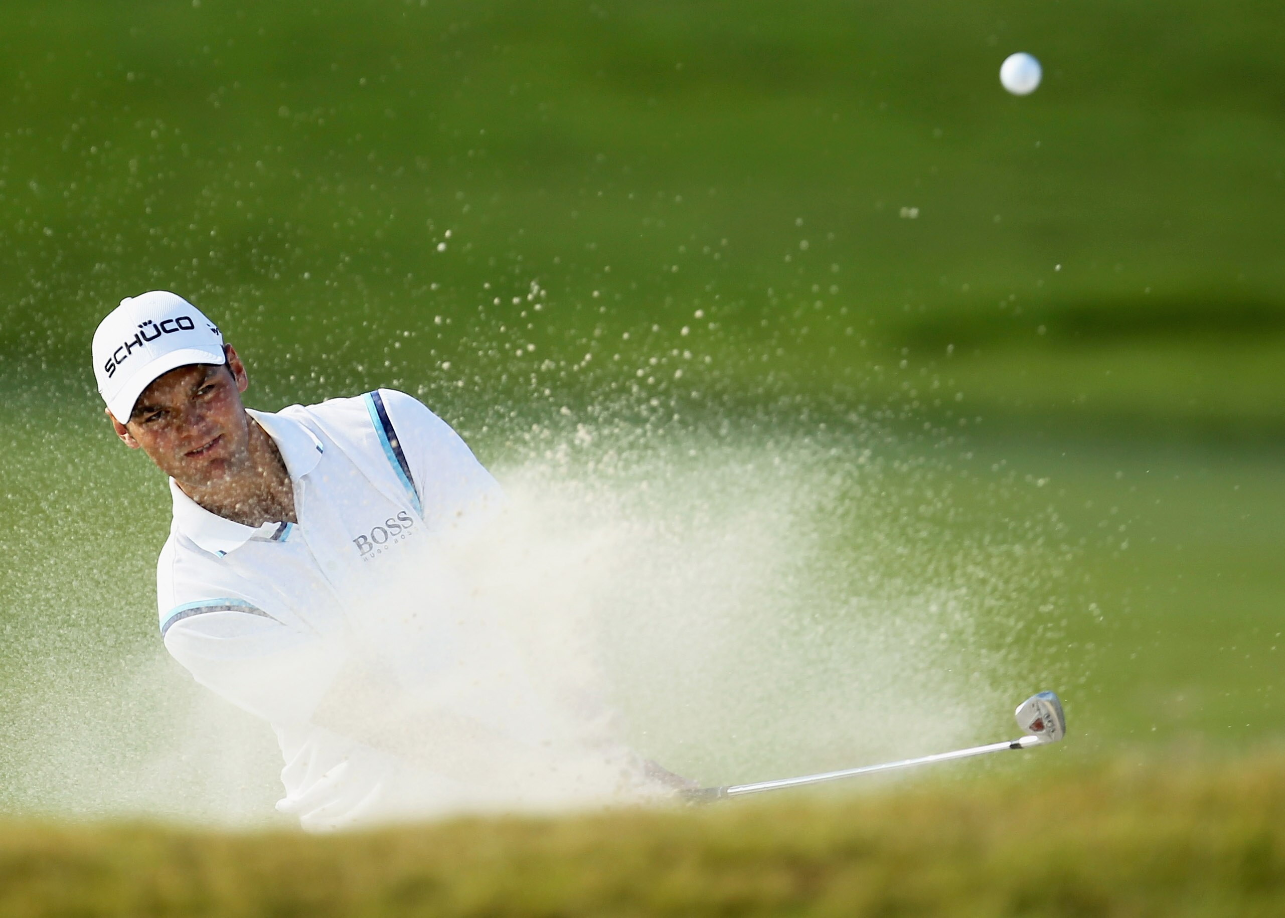 DORAL, FL - MARCH 12: Martin Kaymer of Germany hits a bunker shot on the 16th hole during the third round of the 2011 WGC- Cadillac Championship at the TPC Blue Monster at the Doral Golf Resort and Spa on March 12, 2011 in Doral, Florida. (Photo by Mike DORAL, FL - MARCH 12: Martin Kaymer of Germany hits a bunker shot on the 16th hole during the third round of the 2011 WGC- Cadillac Championship at the TPC Blue Monster at the Doral Golf Resort and Spa on March 12, 2011 in Doral, Florida. (Photo by Mike