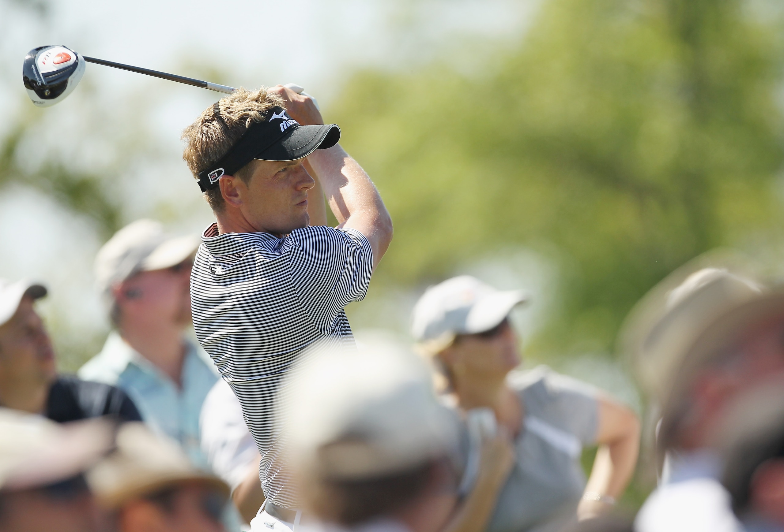 DORAL, FL - MARCH 13:  Luke Donald of England hits his tee shot on the third hole during the final round of the 2011 WGC- Cadillac Championship at the TPC Blue Monster at the Doral Golf Resort and Spa on March 13, 2011 in Doral, Florida.  (Photo by Mike E