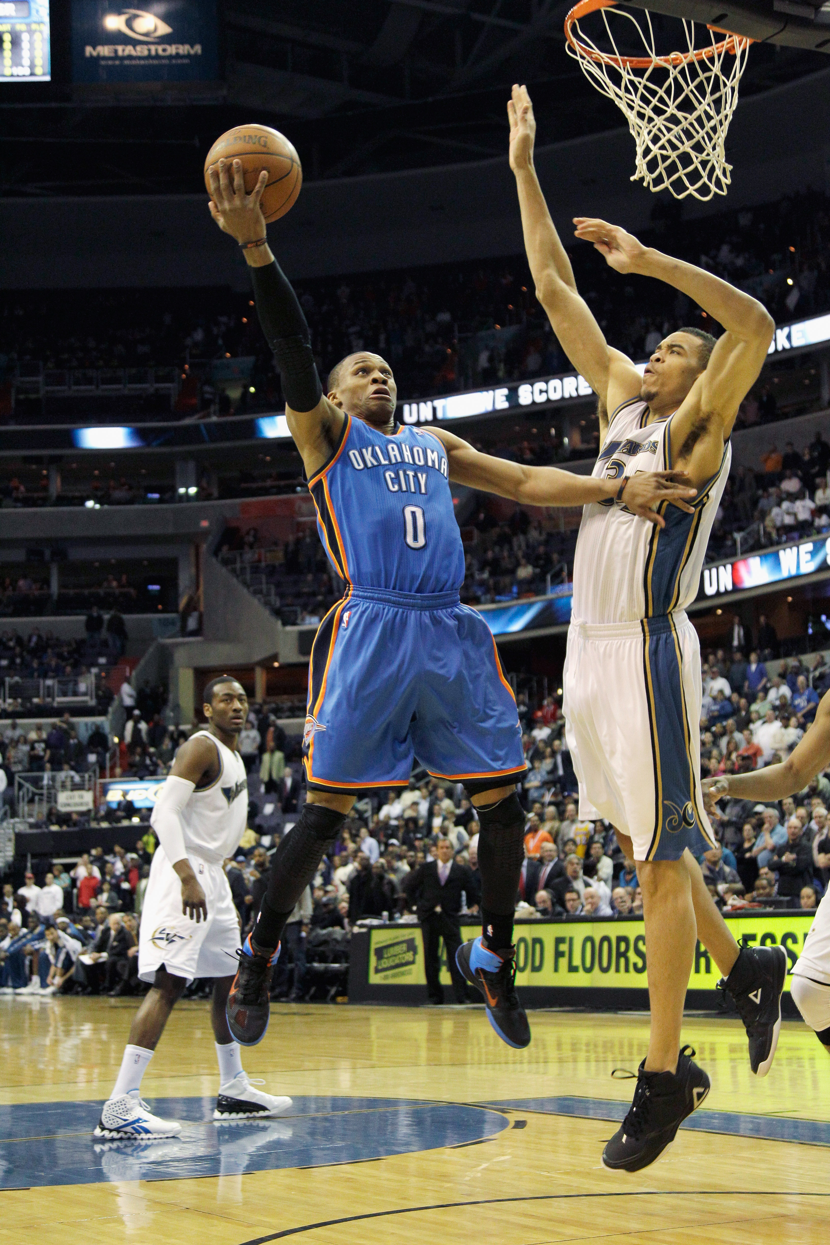 WASHINGTON, DC - MARCH 14:  Russell Westbrook #0 of the Oklahoma City Thunder puts up a shot in front of JaVale McGee #34 of the Washington Wizards during the first half at the Verizon Center on March 14, 2011 in Washington, DC. NOTE TO USER: User express
