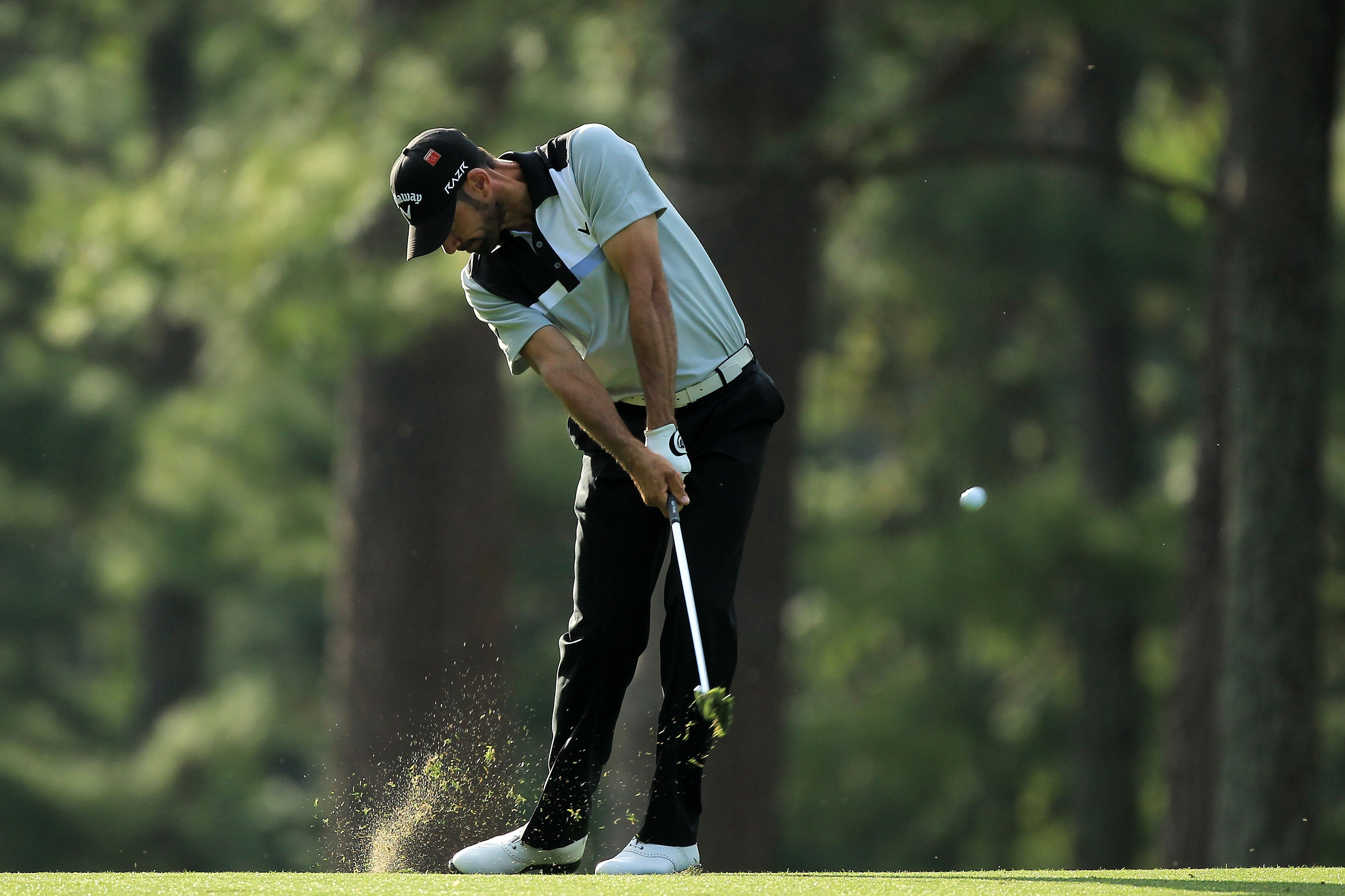 AUGUSTA, GA - APRIL 07:  Alvaro Quiros of Spain hits his approach shot on the 14th hole during the first round of the 2011 Masters Tournament at Augusta National Golf Club on April 7, 2011 in Augusta, Georgia.  (Photo by David Cannon/Getty Images)