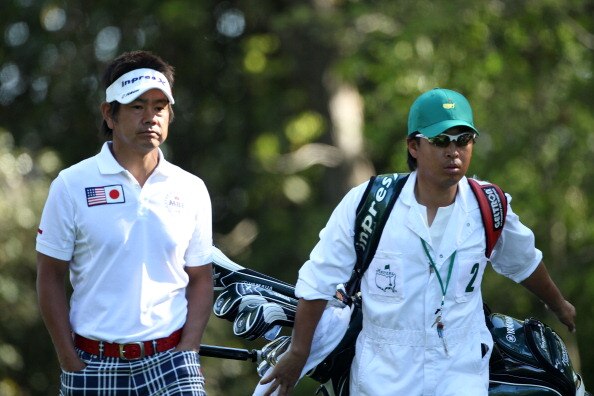 AUGUSTA, GA - APRIL 07:  Hiroyuki Fujita of Japan walks with his caddie Atsushi Umehara off the second tee during the first round of the 2011 Masters Tournament at Augusta National Golf Club on April 7, 2011 in Augusta, Georgia.  (Photo by Andrew Redingto