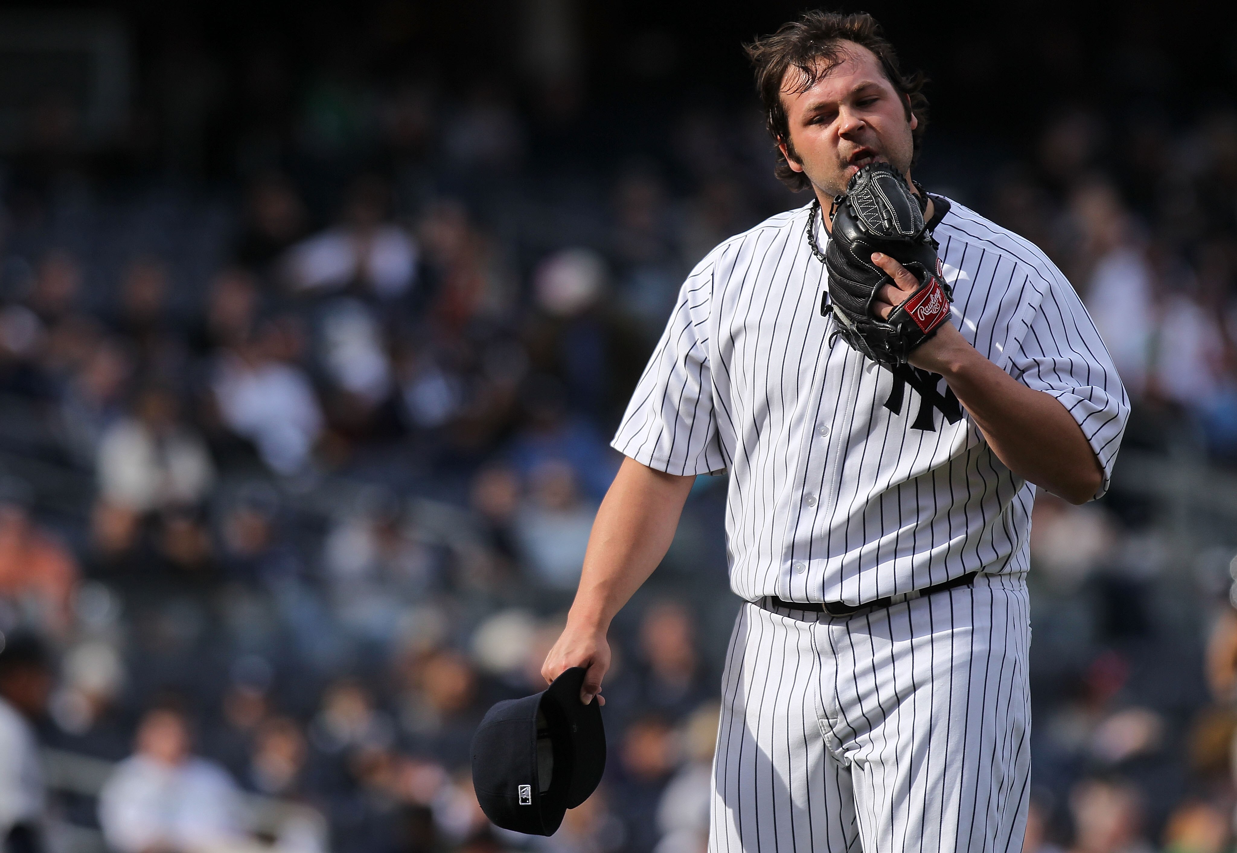 NEW YORK, NY - APRIL 03:  Joba Chamberlain #62 of the New York Yankees reacts walking back to the dugout in the ninth inning against the Detroit Tigers at Yankee Stadium on April 3, 2011 in the Bronx borough of New York City.  (Photo by Nick Laham/Getty I
