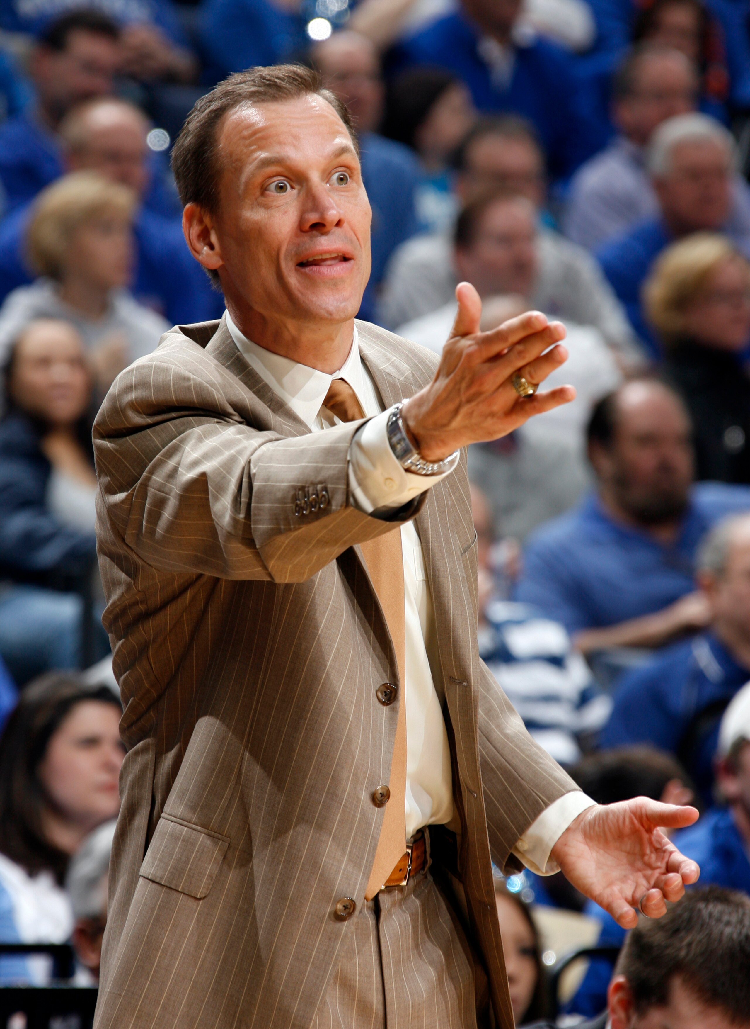 MEMPHIS, TN - MARCH 15: Doug Wojcik, head coach of the Tulsa Golden Hurricane reacts to a call against the Memphis Tigers during the finals of the Conference USA Basketball Tournament at FedExForum on March 15, 2008 in Memphis, Tennessee. Memphis beat Tul MEMPHIS, TN - MARCH 15: Doug Wojcik, head coach of the Tulsa Golden Hurricane reacts to a call against the Memphis Tigers during the finals of the Conference USA Basketball Tournament at FedExForum on March 15, 2008 in Memphis, Tennessee. Memphis beat Tul