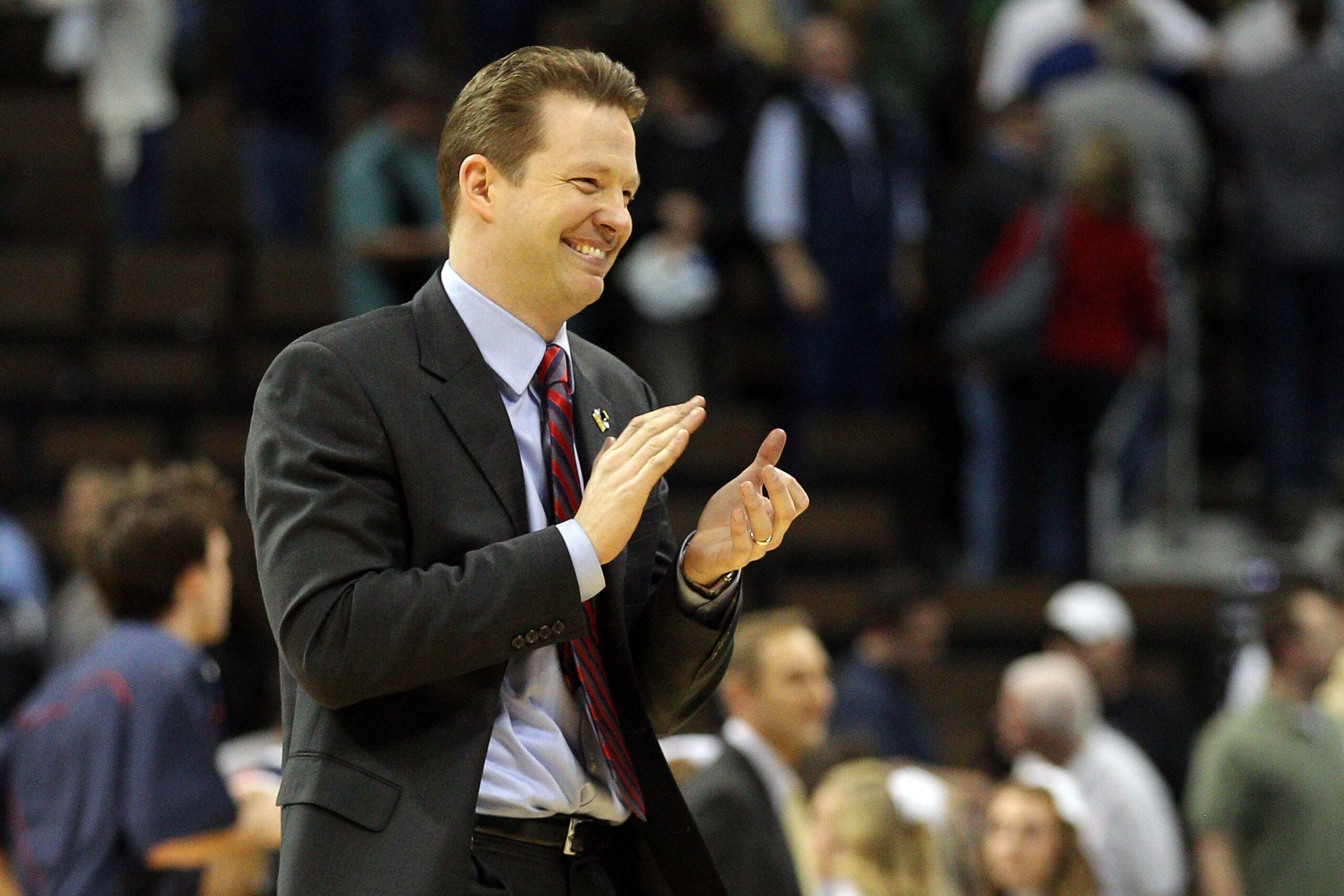 DENVER, CO - MARCH 17: Head coach Chris Mooney of the Richmond Spiders celebrates after defeating the Vanderbilt Commodores during the second round of the 2011 NCAA men's basketball tournament at Pepsi Center on March 17, 2011 in Denver, Colorado. Richmo DENVER, CO - MARCH 17: Head coach Chris Mooney of the Richmond Spiders celebrates after defeating the Vanderbilt Commodores during the second round of the 2011 NCAA men's basketball tournament at Pepsi Center on March 17, 2011 in Denver, Colorado. Richmo