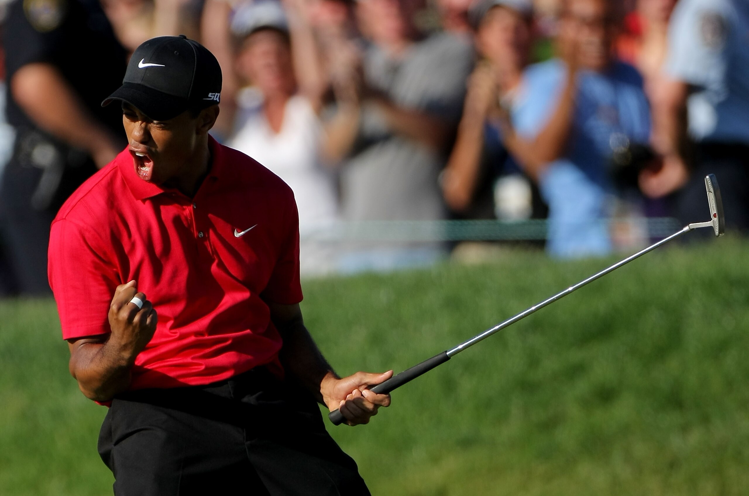 SAN DIEGO - JUNE 15:  Tiger Woods reacts to his birdie putt on the 18th green to force a playoff with Rocco Mediate during the final round of the 108th U.S. Open at the Torrey Pines Golf Course (South Course) on June 15, 2008 in San Diego, California.  (P