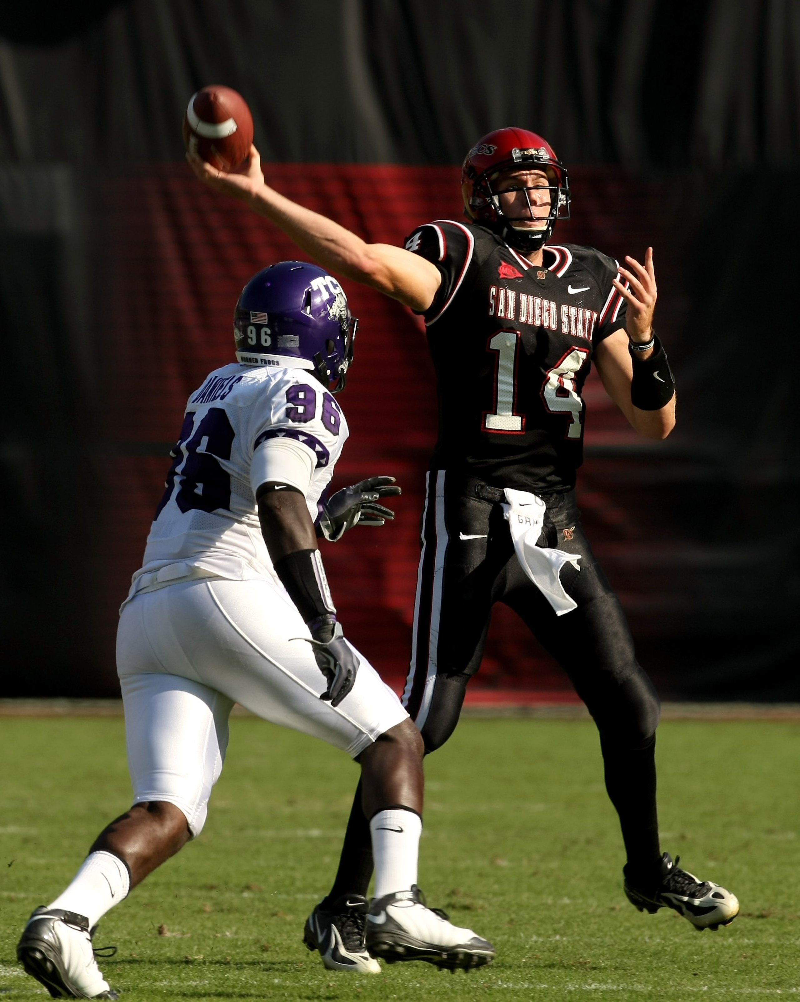 SAN DIEGO - NOVEMBER 7: Quarterback Ryan Lindley #14 of the San Diego State Aztecs throws a pass over defensive end Wayne Daniels #96 of the Texas Christian University Horned Frogs on November 7, 2009 at Qualcomm Stadium in San Diego, California. (Pho SAN DIEGO - NOVEMBER 7: Quarterback Ryan Lindley #14 of the San Diego State Aztecs throws a pass over defensive end Wayne Daniels #96 of the Texas Christian University Horned Frogs on November 7, 2009 at Qualcomm Stadium in San Diego, California. (Pho