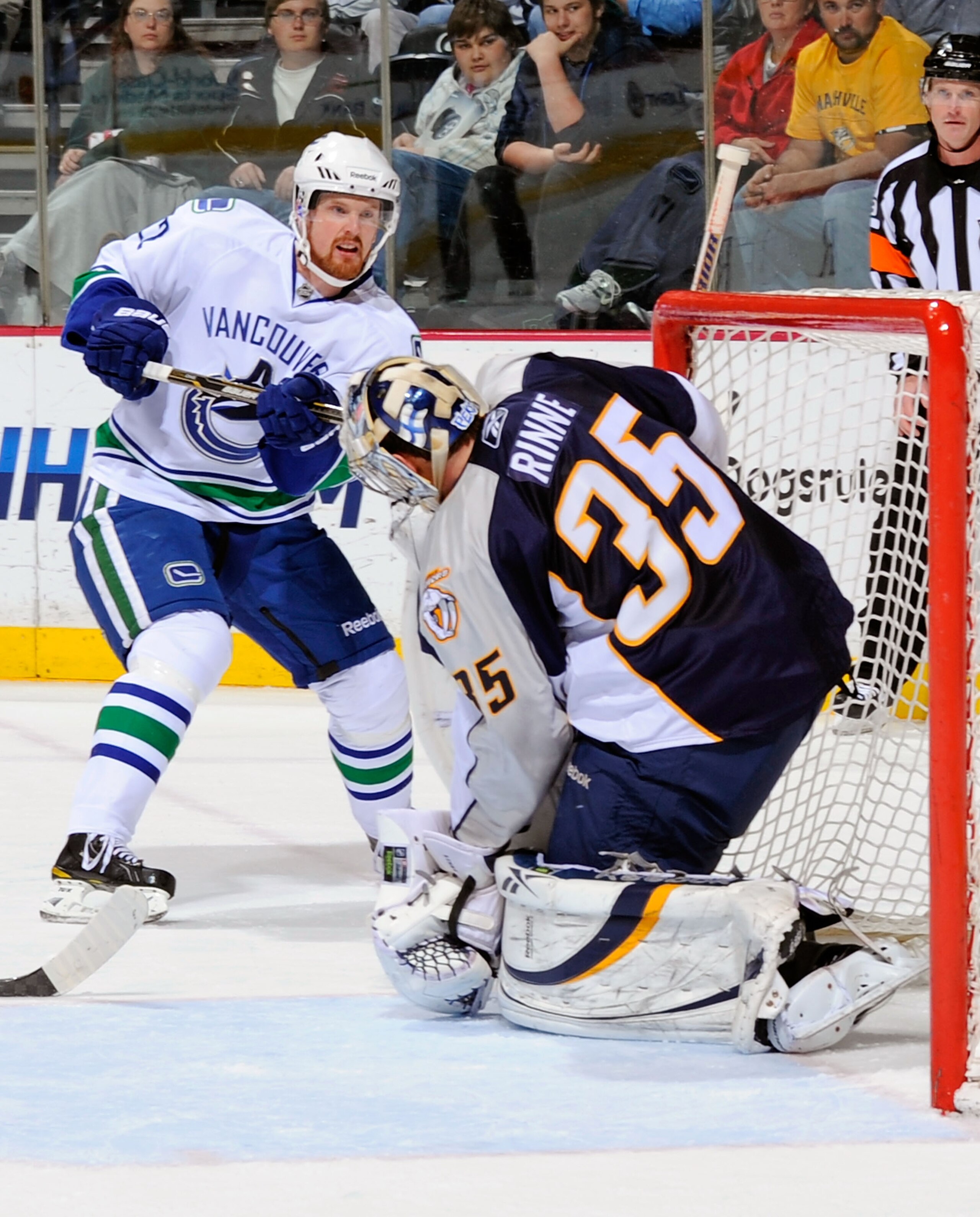 NASHVILLE, TN - MARCH 29:  Daniel Sedin #22 of the Vancouver Canucks fires a shot off the post next to Pekka Rinne #35 of the Nashville Predators on March 29, 2011 at the Bridgestone Arena in Nashville, Tennessee.  (Photo by Frederick Breedon/Getty Images