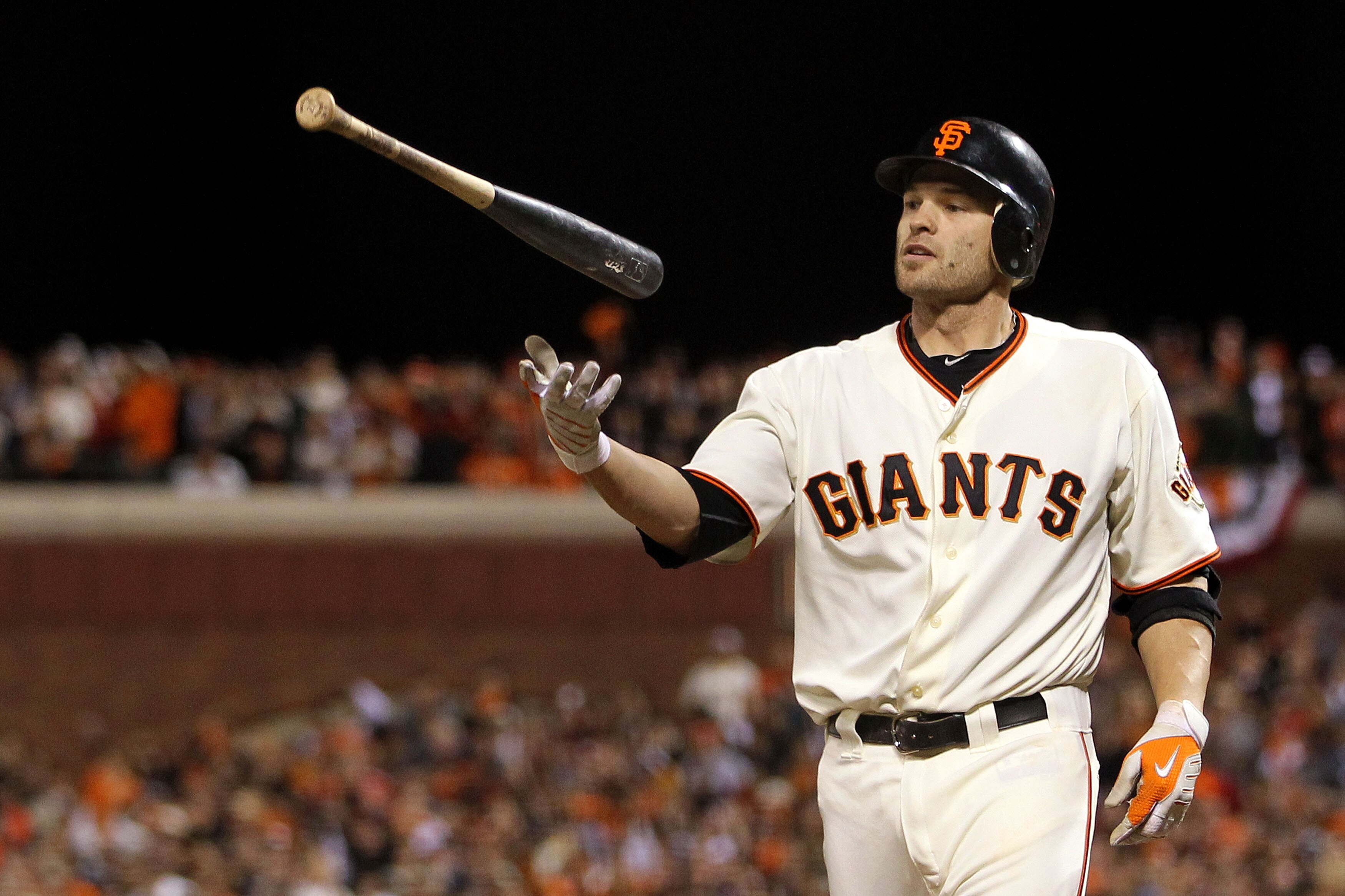 SAN FRANCISCO - OCTOBER 28:  Freddy Sanchez #21 of the San Francisco Giants throws his bat up after striking out in the eighth inning while taking on the Texas Rangers in Game Two of the 2010 MLB World Series at AT&T Park on October 28, 2010 in San Franci