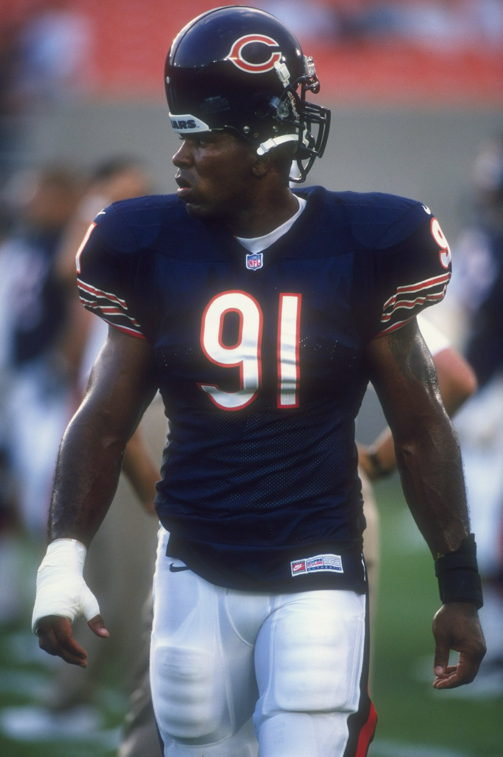21 Aug 1998:  Defensive end John Thierry #91 of the Chicago Bears looks on during a pre-season game against the Buffalo Bills at Soldier Field in Chicago, Illinois. The Bills defeated the Bears 17-9.