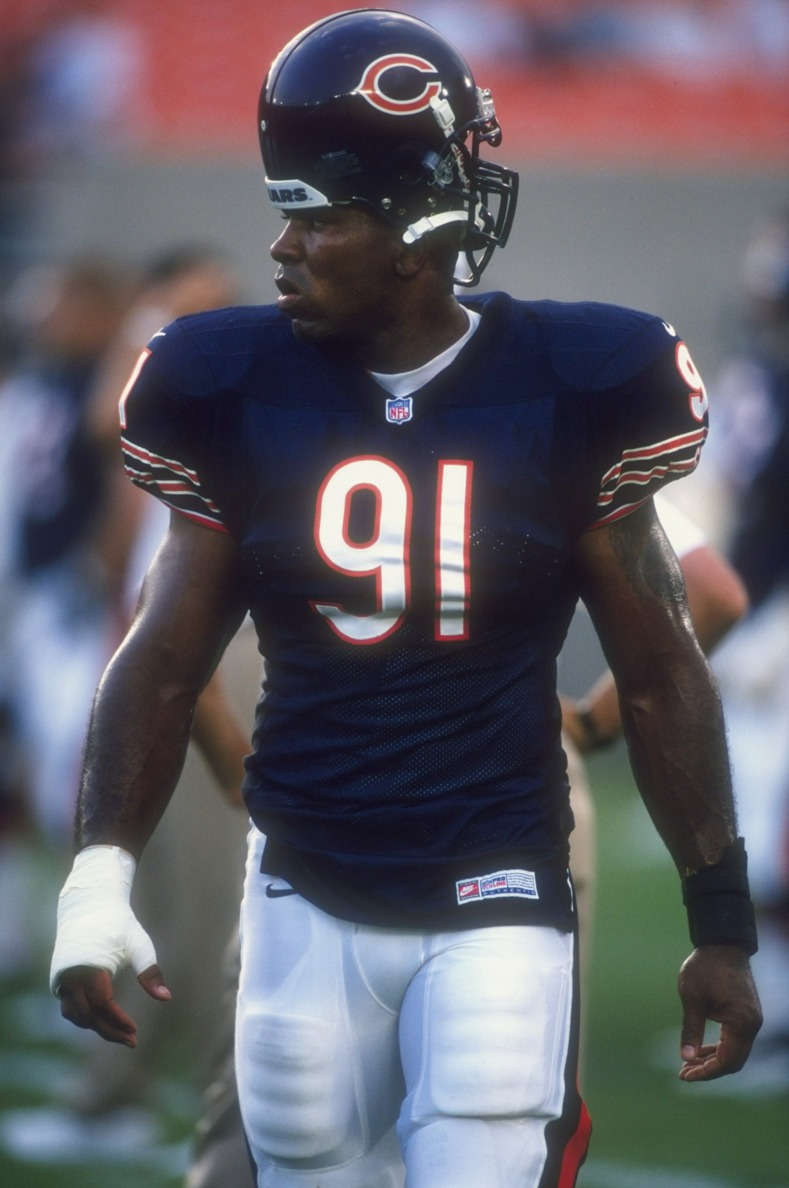21 Aug 1998:  Defensive end John Thierry #91 of the Chicago Bears looks on during a pre-season game against the Buffalo Bills at Soldier Field in Chicago, Illinois. The Bills defeated the Bears 17-9.