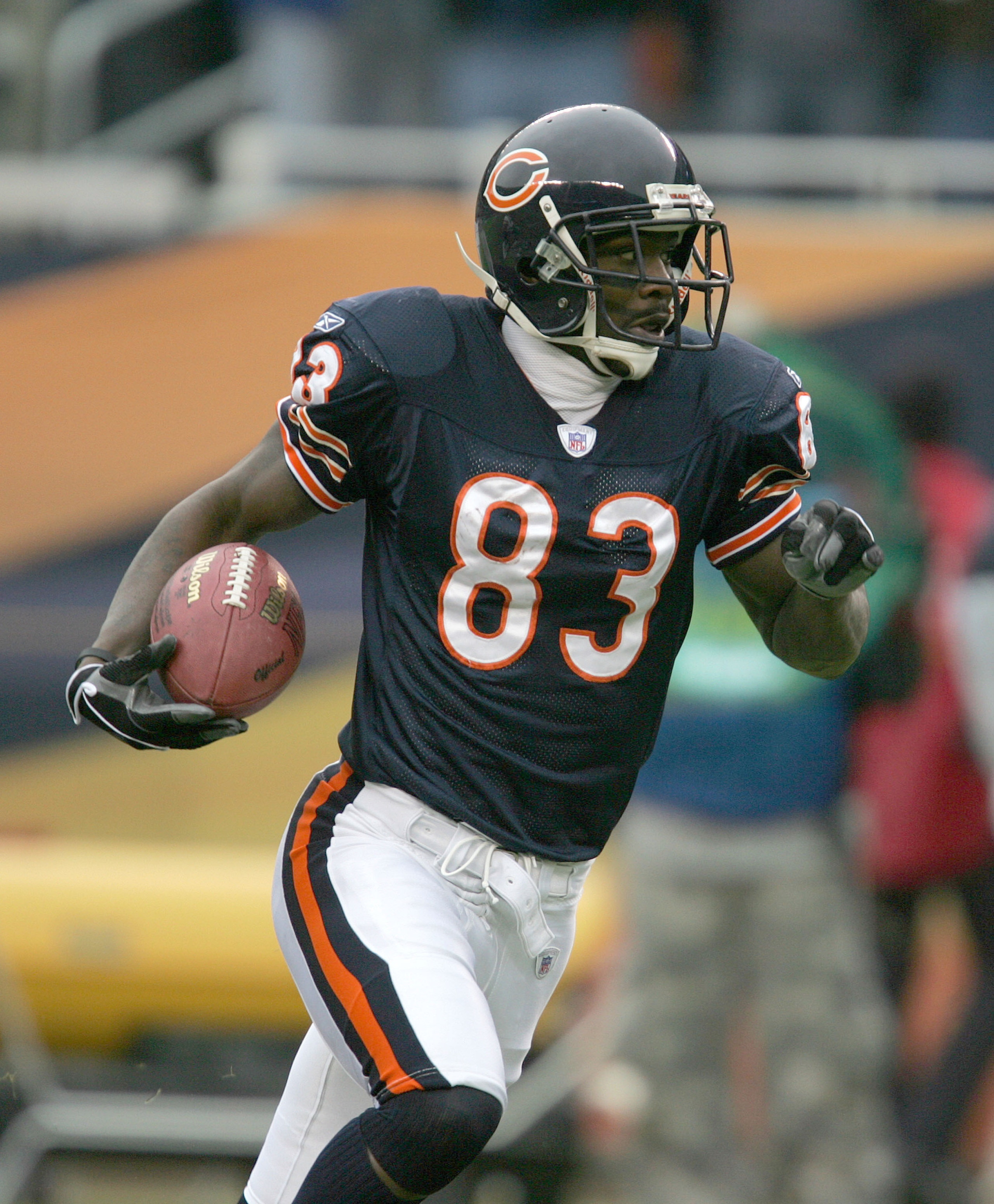 CHICAGO - JANUARY 2: Wide receiver David Terrell #83 of the Chicago Bears takes the ball 63 yards after a reception against the Green Bay Packers on January 2, 2005 at Soldier Field in Chicago, Illinois. (Photo by Jonathan Daniel/Getty Images)