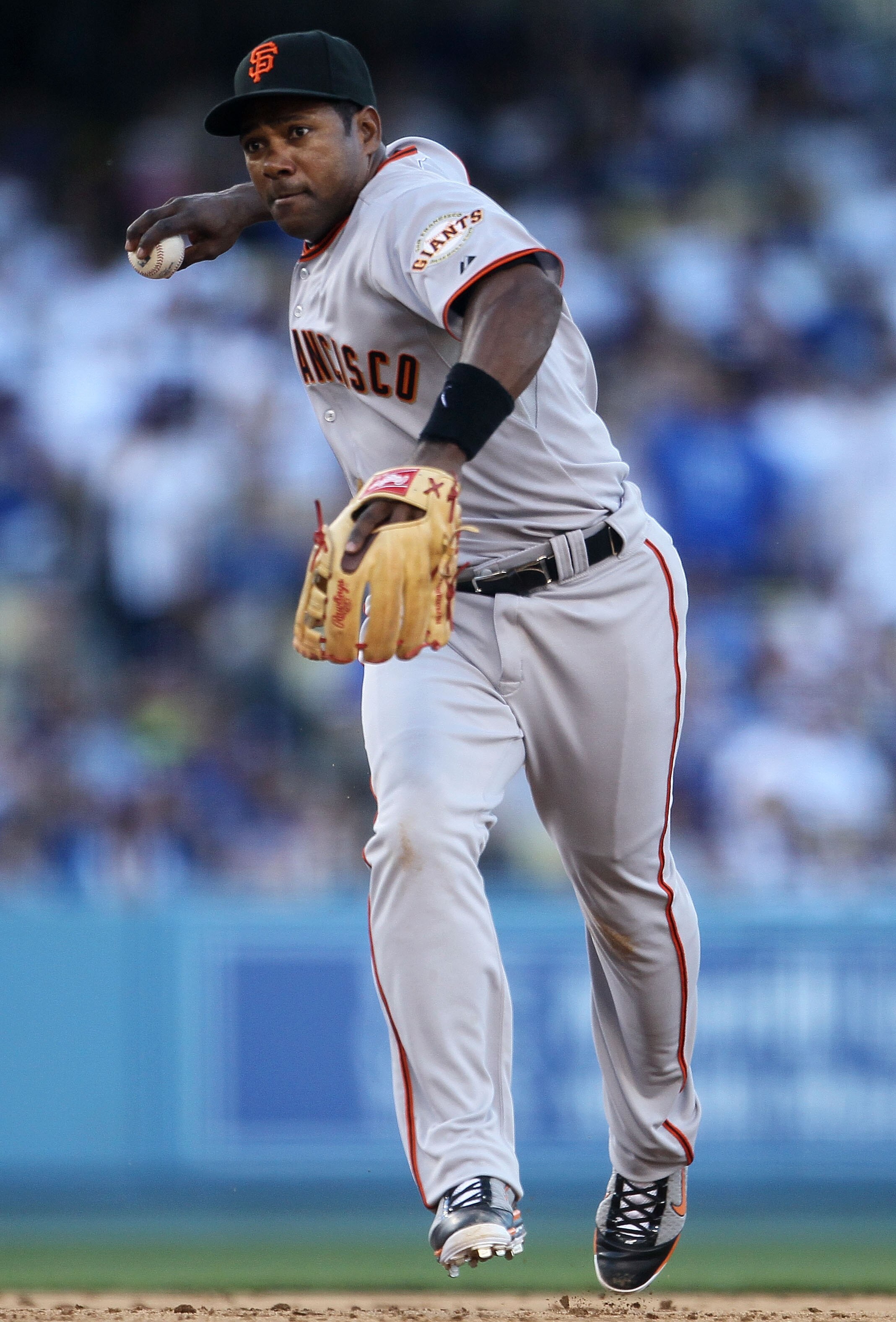 LOS ANGELES, CA - MARCH 31:  Miguel Tejada #10 of the San Francisco Giants throws to first base against the Los Angeles Dodgers during their game on Opening Day at Dodger Stadium on March 31, 2011 in Los Angeles, California.  (Photo by Jeff Gross/Getty Im