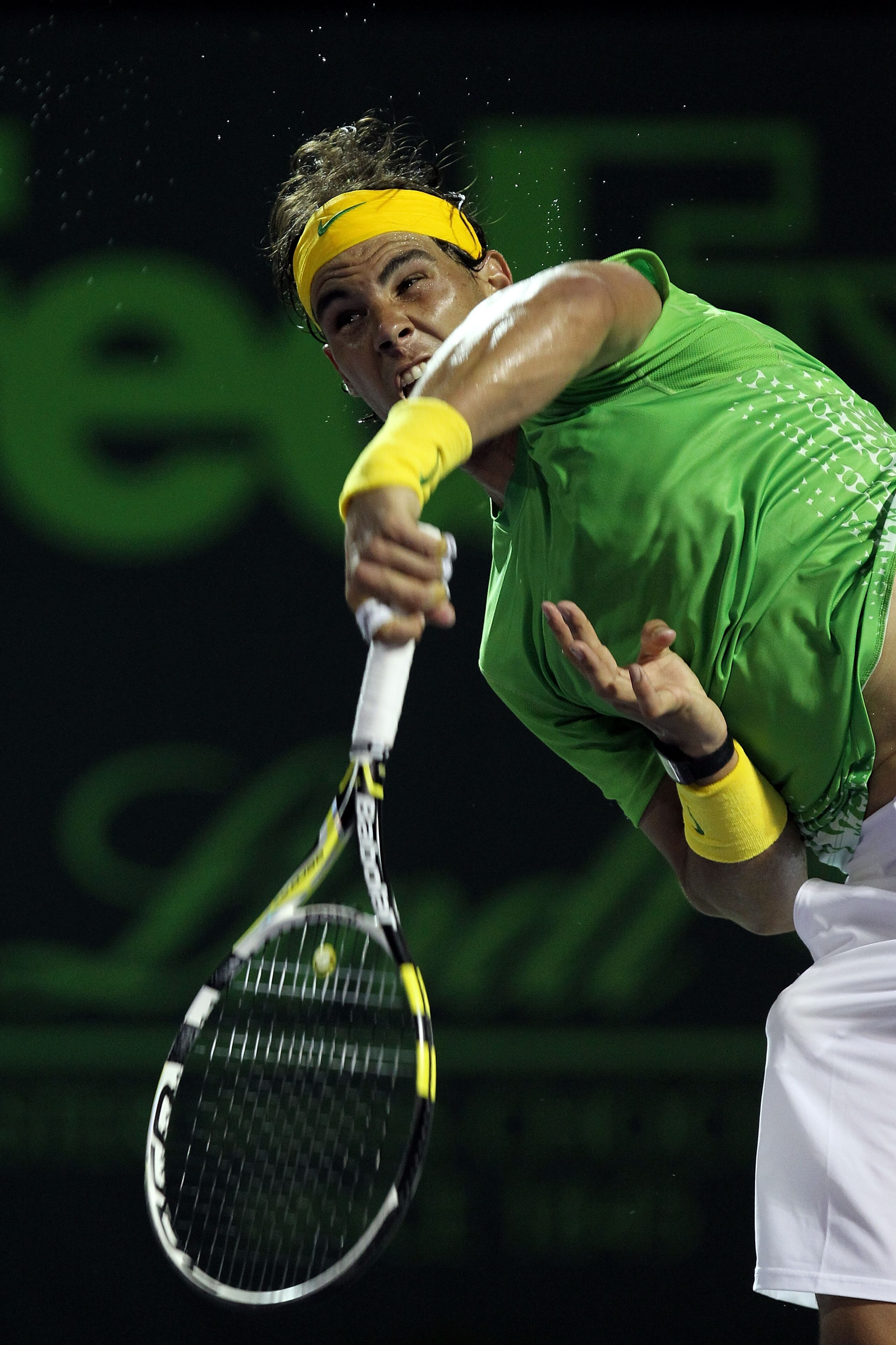 KEY BISCAYNE, FL - APRIL 01:  Rafael Nadal of Spain serves against Roger Federer of Switzerland during their men's semifinal singles match at the Sony Ericsson Open at Crandon Park Tennis Center on April 1, 2011 in Key Biscayne, Florida.  (Photo by Al Bel