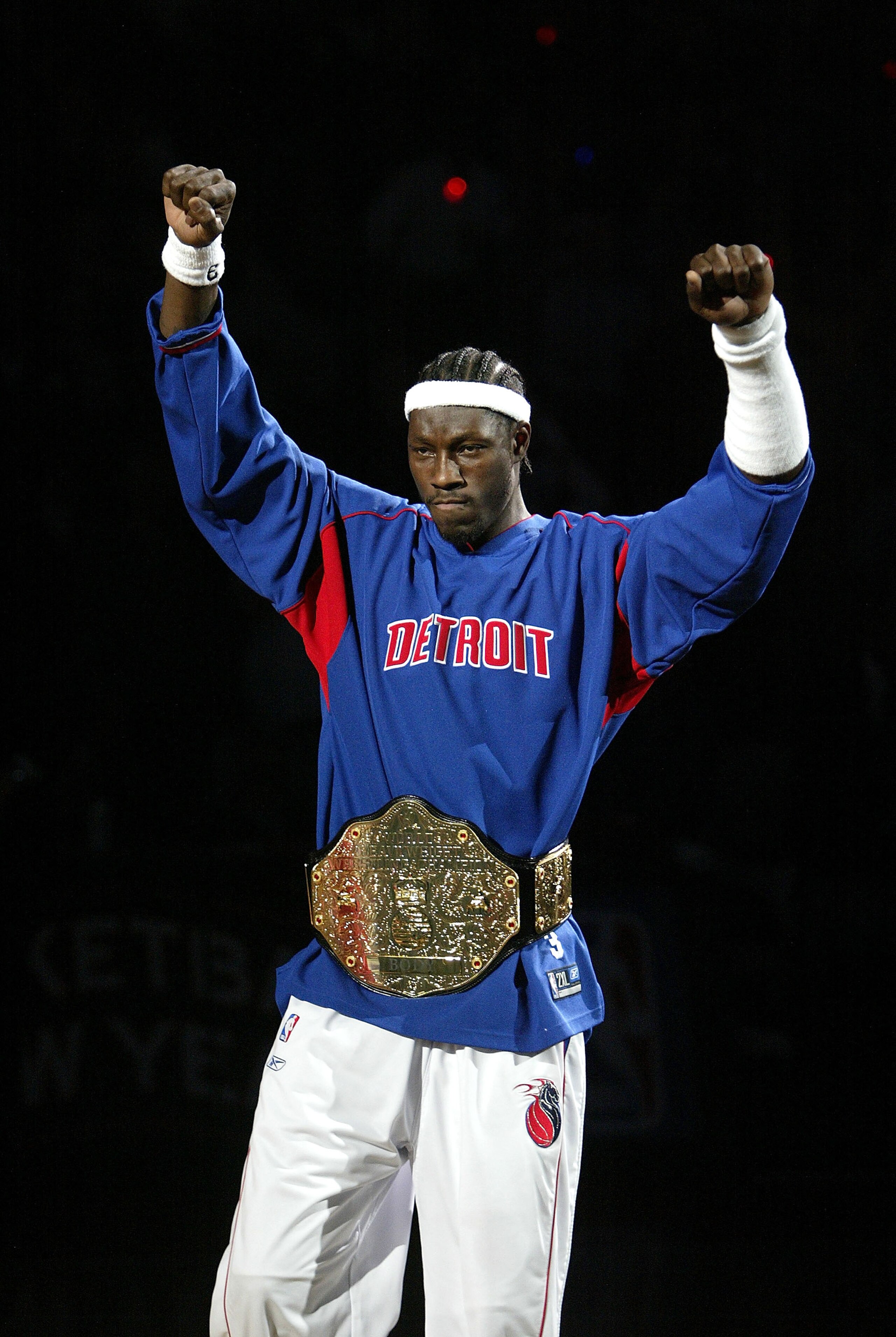 AUBURN HILLS, MI - NOVEMBER 2:  Ben Wallace #3 of the Detroit Pistons raises his arms after being introduced to a sellout crowd as the NBA defending champion Detroit Pistons hold a pregame ceremony before their game against the Houston Rockets on November