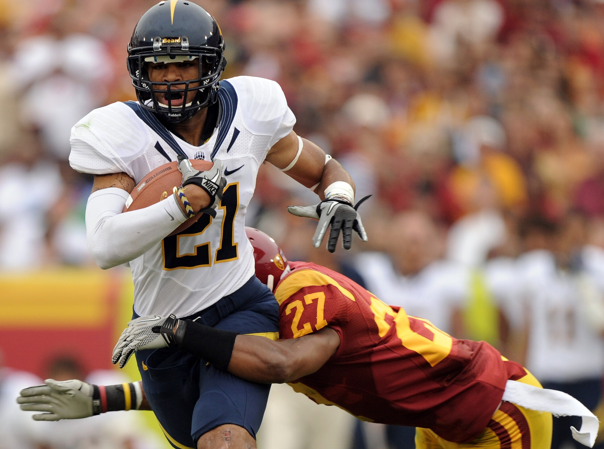 LOS ANGELES, CA - OCTOBER 16: Keenan Allen #21 of the California Golden Bears is tackled by Marshall Jones #27 of the USC Trojans during the second quarter at Los Angeles Memorial Coliseum on October 16, 2010 in Los Angeles, California. (Photo by Harry LOS ANGELES, CA - OCTOBER 16: Keenan Allen #21 of the California Golden Bears is tackled by Marshall Jones #27 of the USC Trojans during the second quarter at Los Angeles Memorial Coliseum on October 16, 2010 in Los Angeles, California. (Photo by Harry