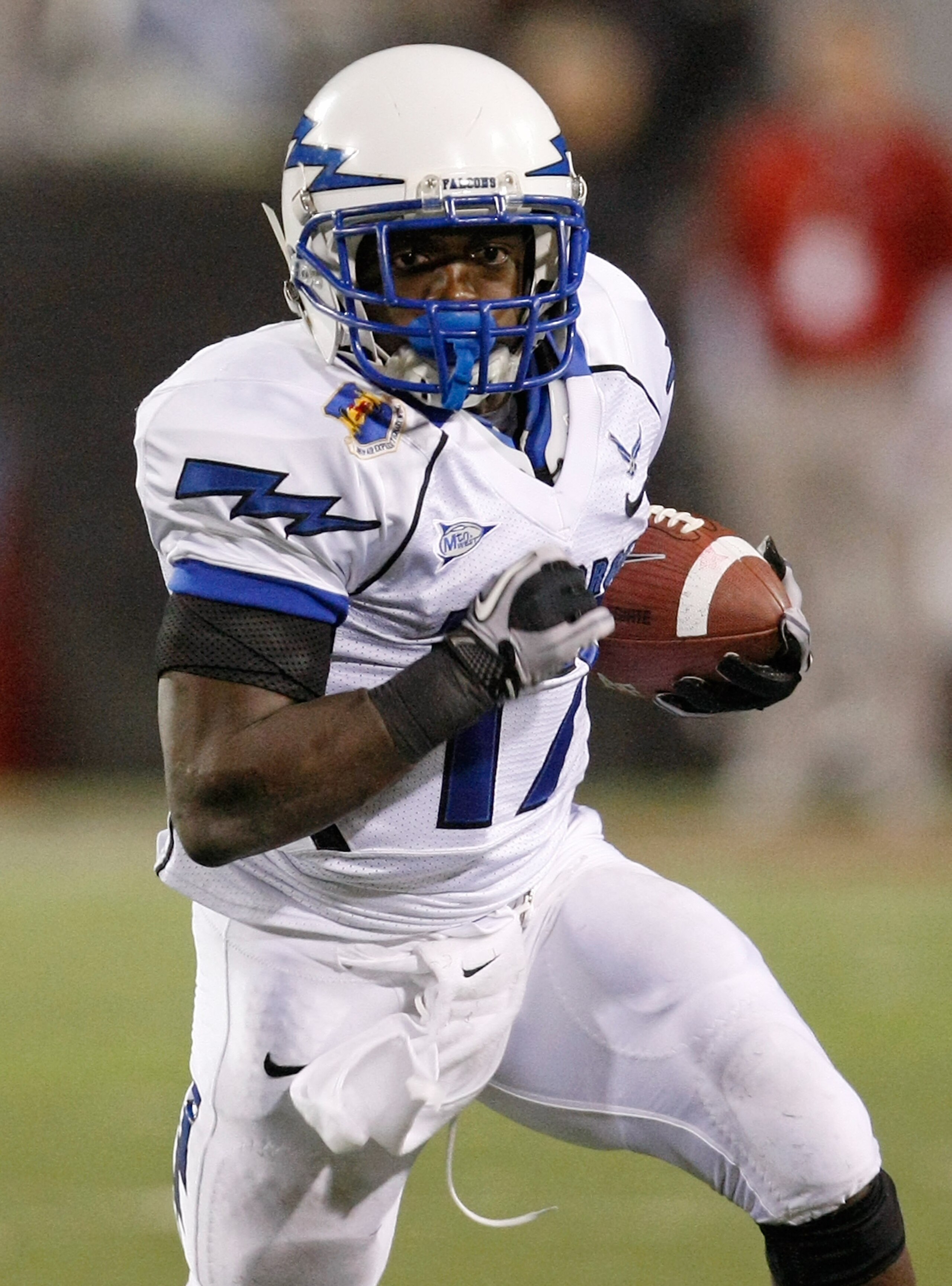 LAS VEGAS - NOVEMBER 18: Asher Clark #17 of the Air Force Falcons runs for yardage against the UNLV Rebels during their game at Sam Boyd Stadium November 18, 2010 in Las Vegas, Nevada. Air Force won 35-20. (Photo by Ethan Miller/Getty Images) LAS VEGAS - NOVEMBER 18: Asher Clark #17 of the Air Force Falcons runs for yardage against the UNLV Rebels during their game at Sam Boyd Stadium November 18, 2010 in Las Vegas, Nevada. Air Force won 35-20. (Photo by Ethan Miller/Getty Images)